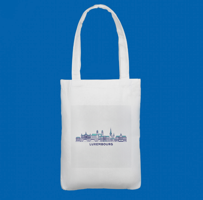 A premium white tote bag showcasing a stylised blue‑purple skyline of Luxembourg. A unique keepsake for travellers and collectors.