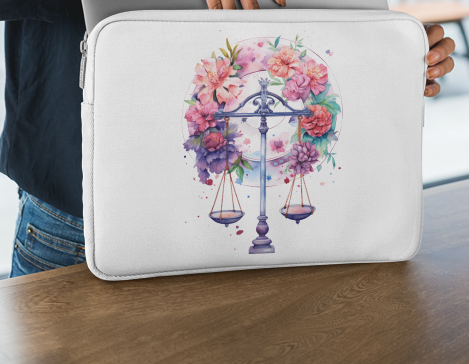 Laptop sleeve featuring an artistic Libra illustration with soft flowing hair and floral accents.