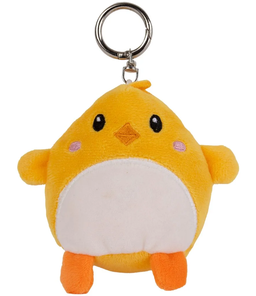 A yellow chick plush key ring with a white belly, orange feet, embroidered features and a metal keychain attachment.