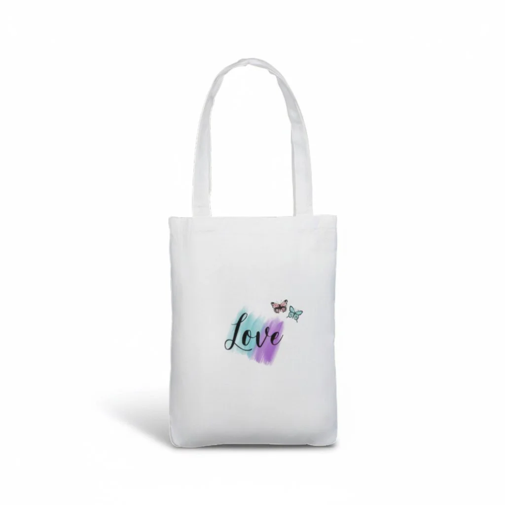 White tote bag displaying the word ‘Love’ in cursive font over teal and purple brushstroke accents with two small butterflies.