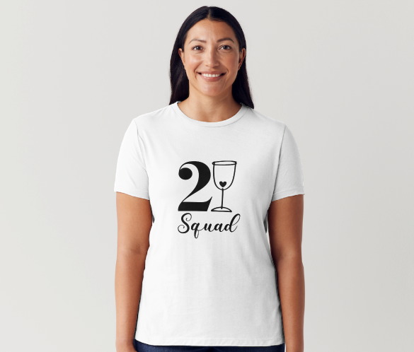 21st birthday celebration photo featuring friends in matching “21 Squad” T‑shirts, holding rosé on a rooftop at sunset.