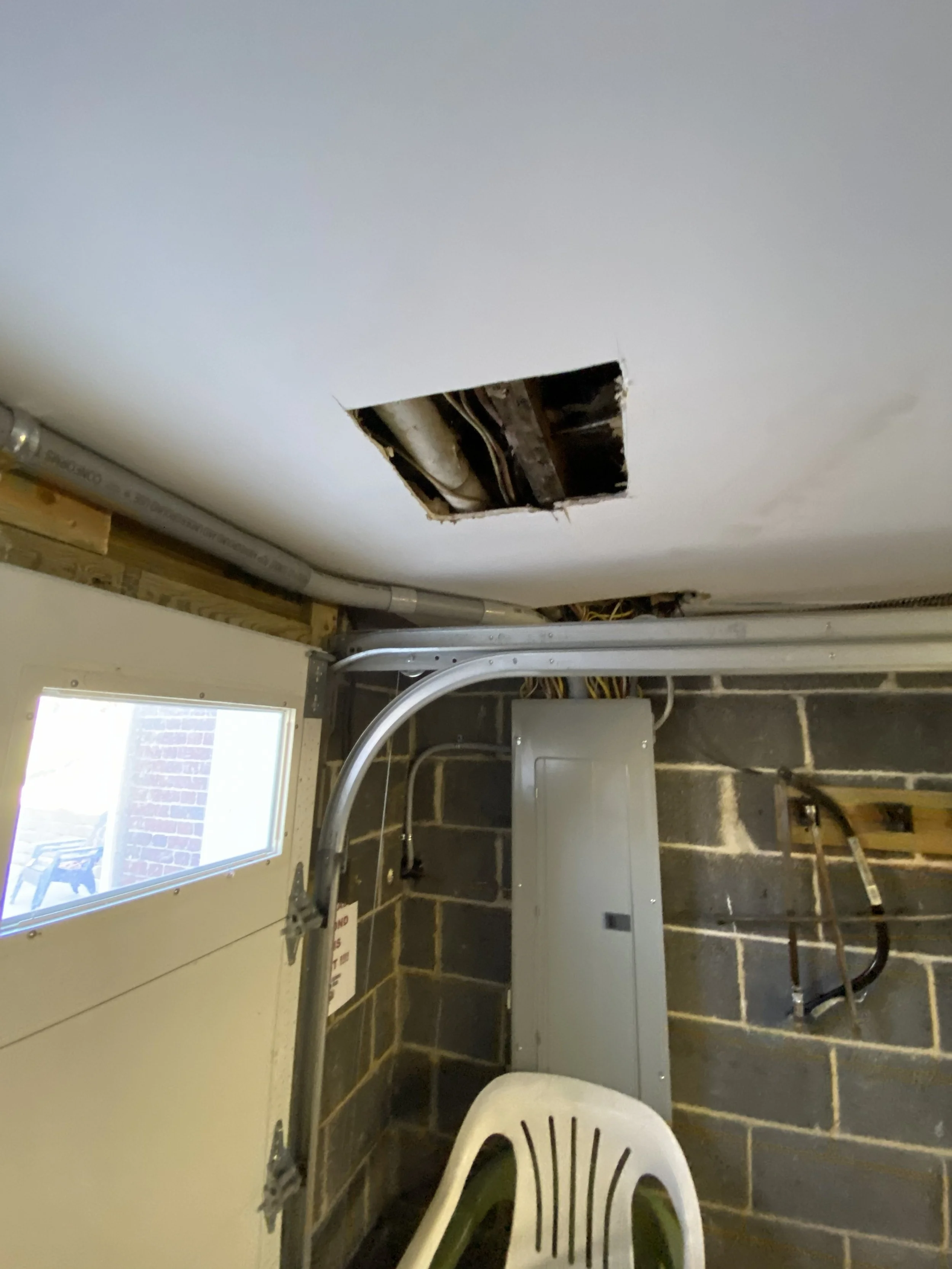 drywall repair before.jpeg