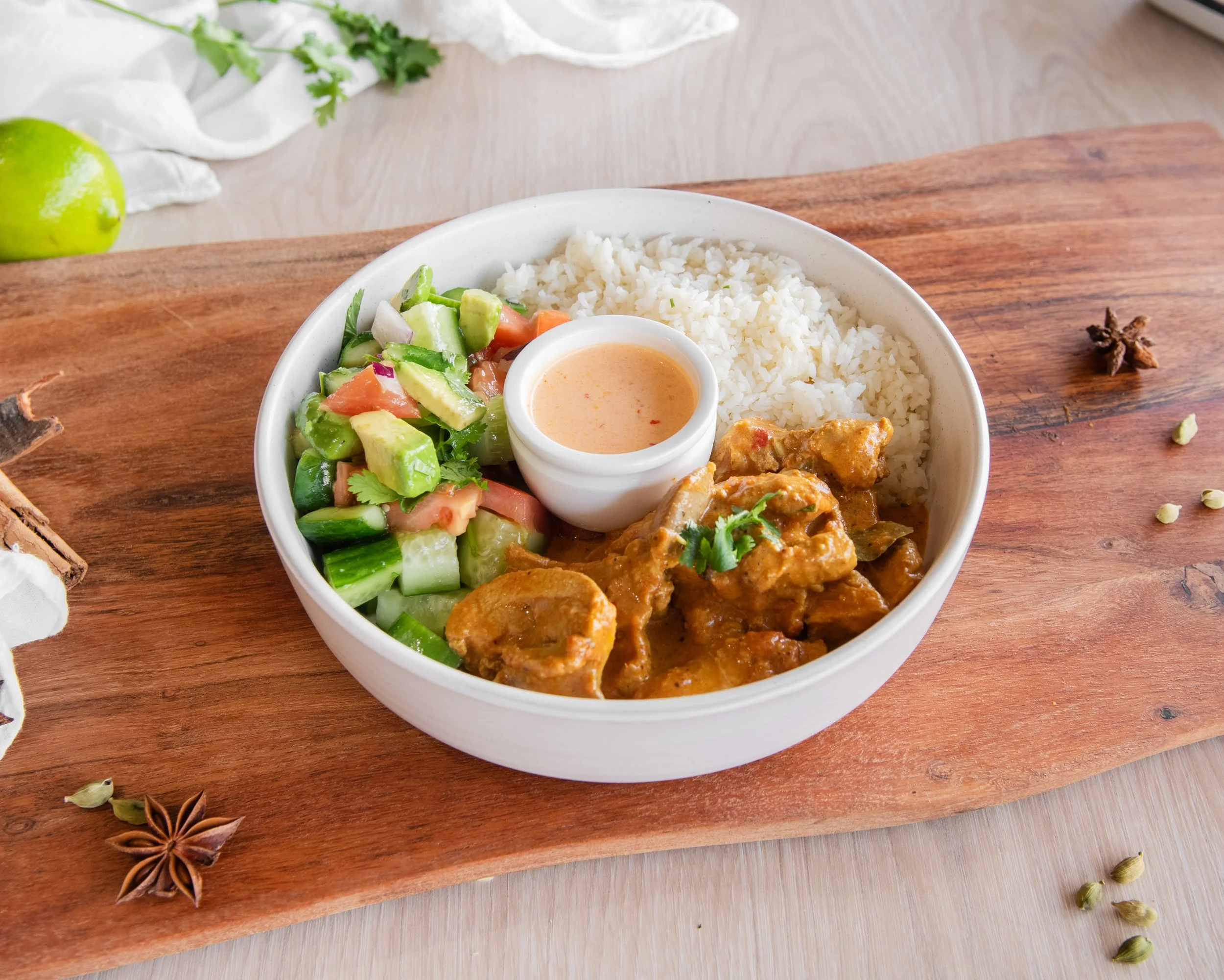 Creamy butter chicken protein bowl served with fluffy rice and fresh salad, packed with bold Indian-inspired flavours. Tender chicken is simmered in a rich, spiced tomato butter sauce, paired with crisp greens for a balanced, high-protein meal. This 