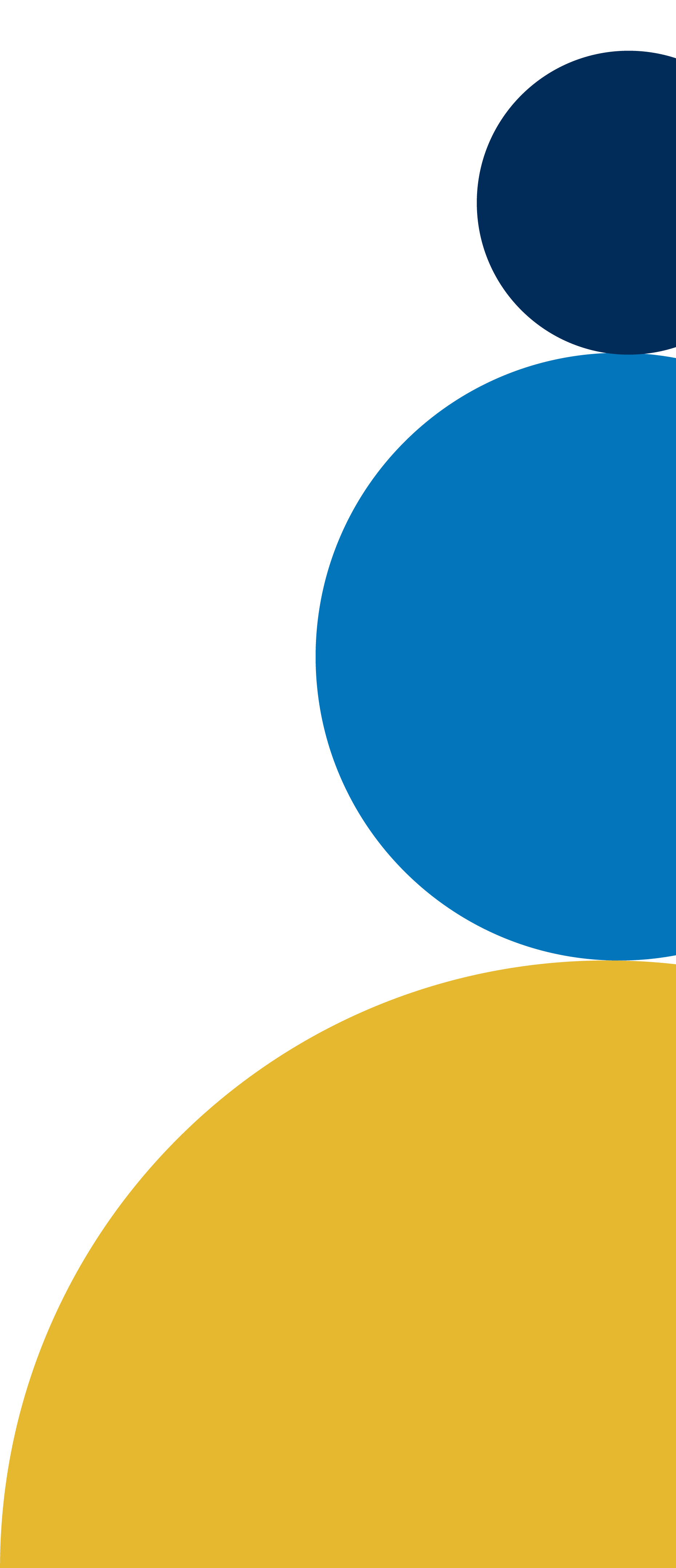 Abstract colorful circles in various sizes, including blue and yellow, on a black background.