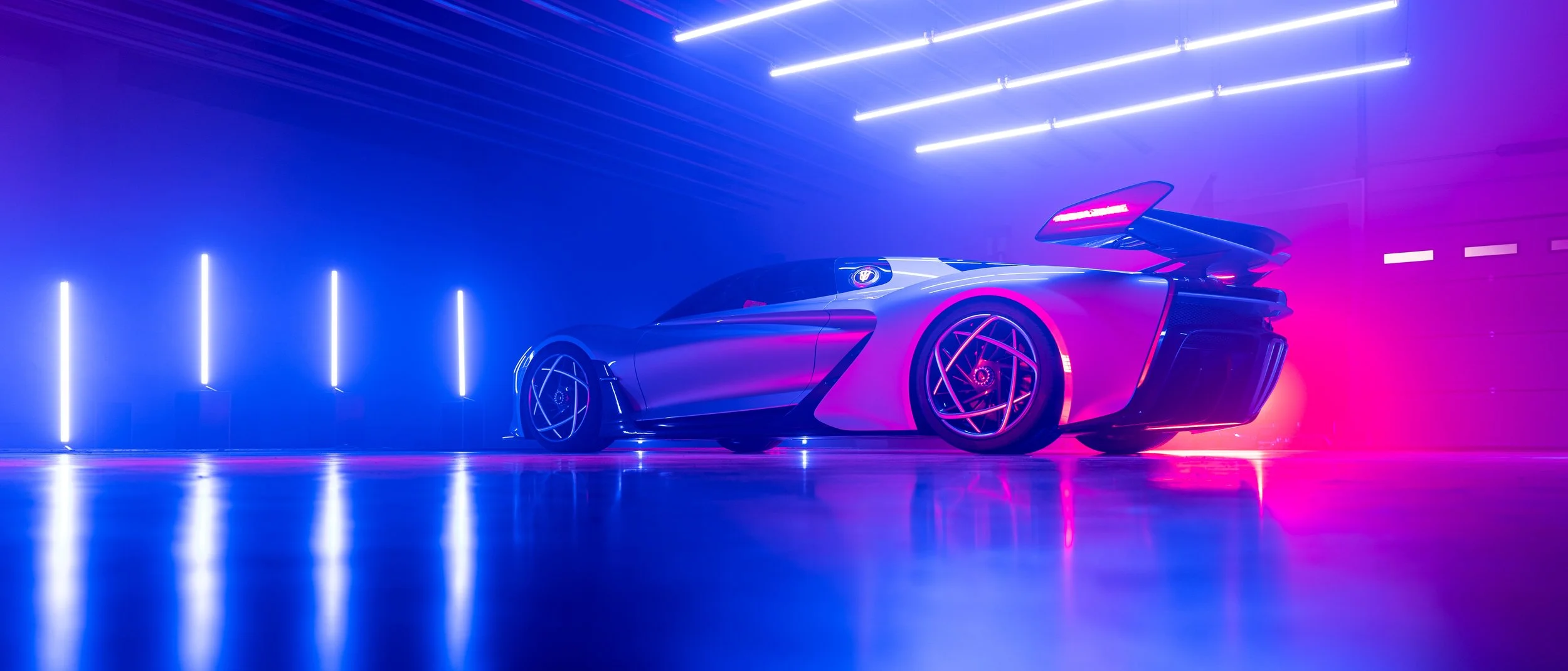 A sleek sports car with vivid purple and pink LED lighting in a futuristic setting with vertical and horizontal light bars.