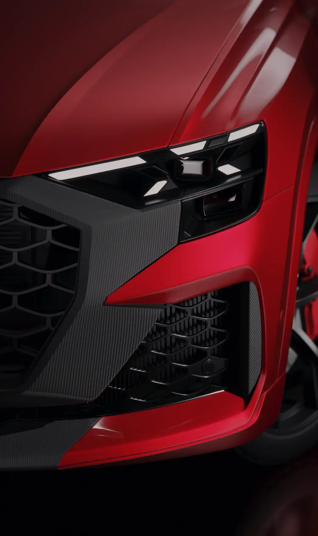 Automotive CGI-Rendering: Detailreiche Nahaufnahme der Frontpartie, Matrix-Scheinwerfer und Carbon-Elemente eines roten Audi Sportwagens.