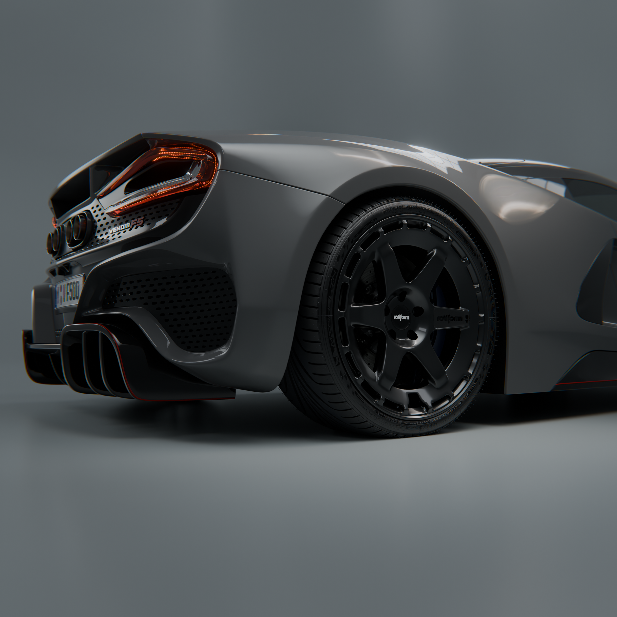 Close-up of a gray sports car's rear end, showcasing a performance rims Rotiform, black custom wheel, rear taillights, and a quad exhaust system.