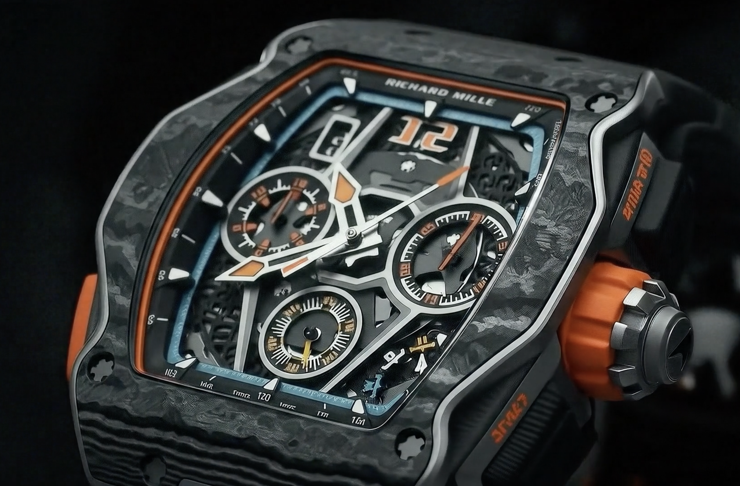 Close-up of a Richard Mille luxury watch with a black and orange design and visible intricate mechanisms.