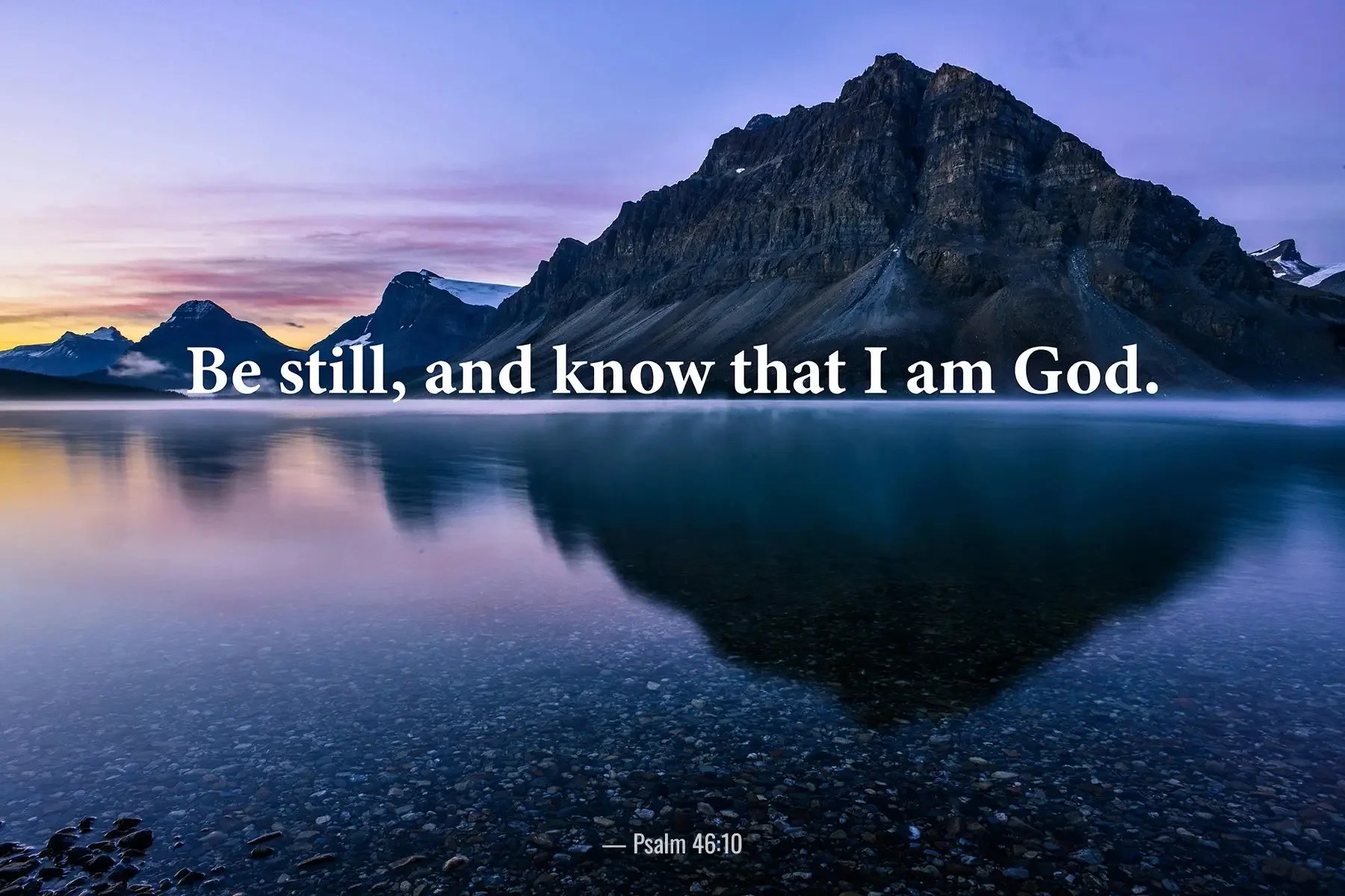 Psalm 46:10 Bible verse reflected in a calm mountain lake encouraging stillness and trust in God.