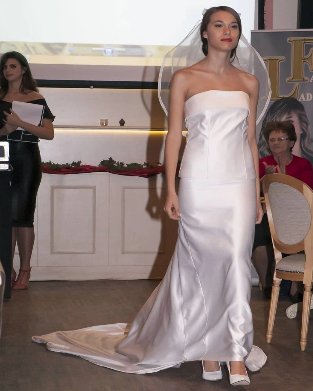 Modern two-piece bespoke wedding dress by master tailor Elena Milani. Clean lines and expert silk tailoring for the contemporary bride seeking minimalist elegance.