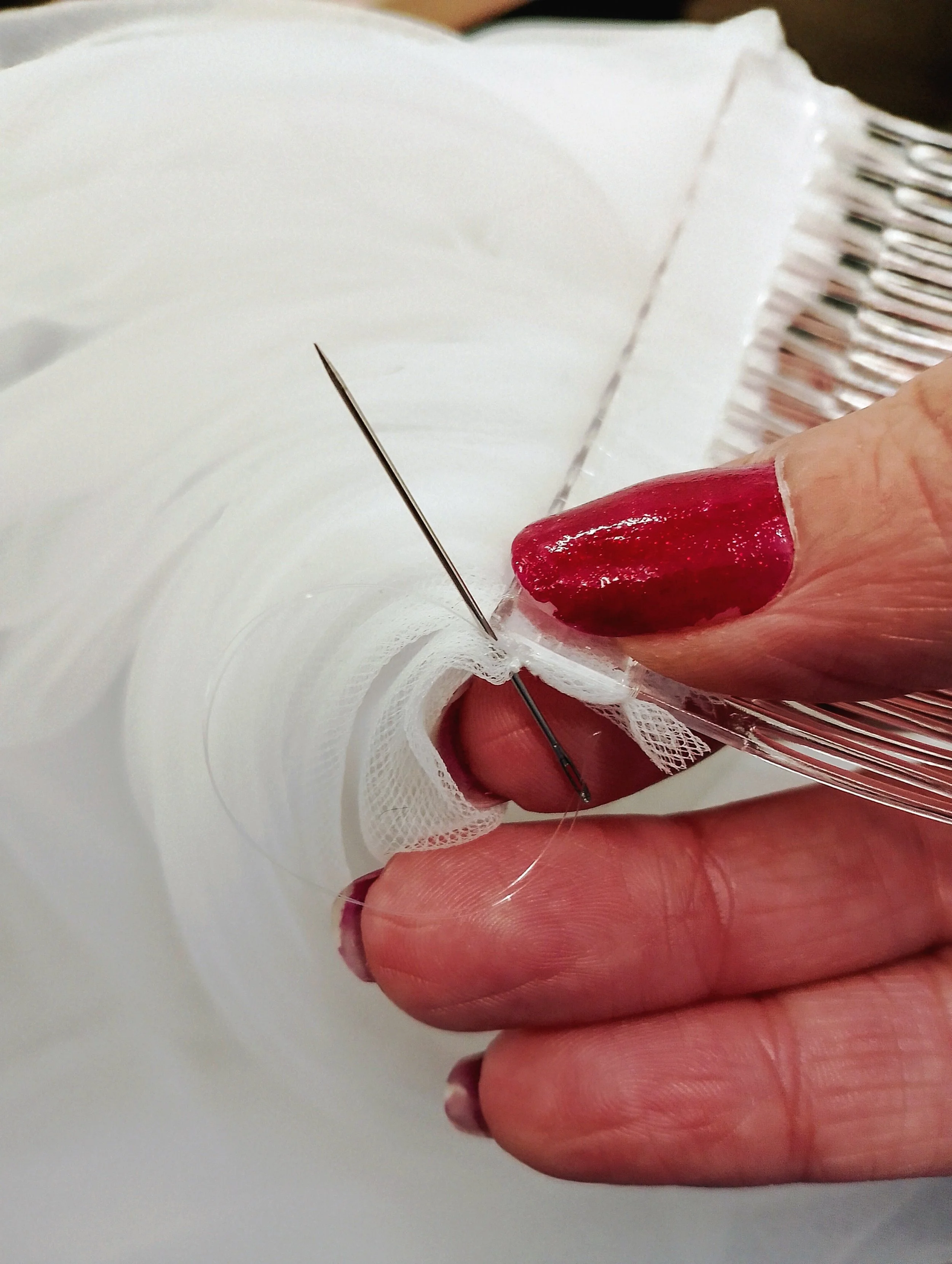 hand sewing a wedding veil