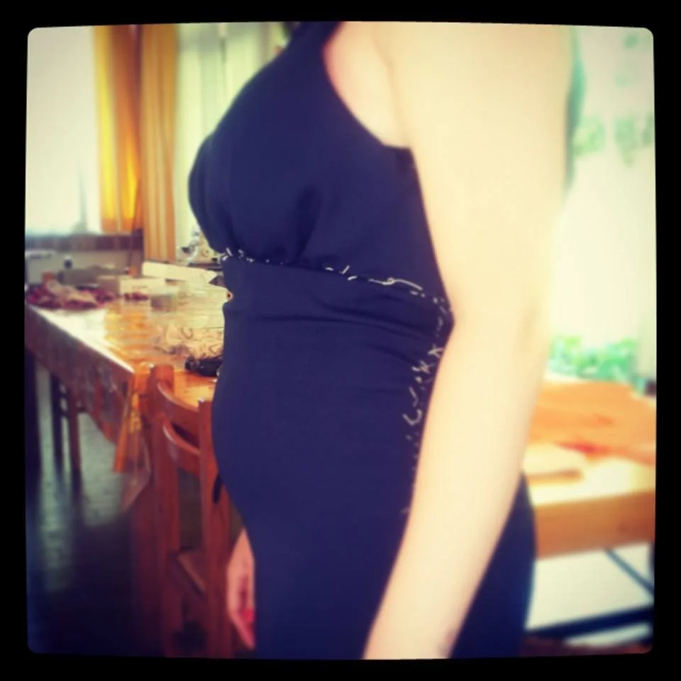 Bespoke fitting for a pregnant Maid of Honour, featuring a navy blue gown with hand-basted pleats and a custom-contoured bodice, hand-crafted in my Burnham-on-Crouch studio using Venetian tailoring.