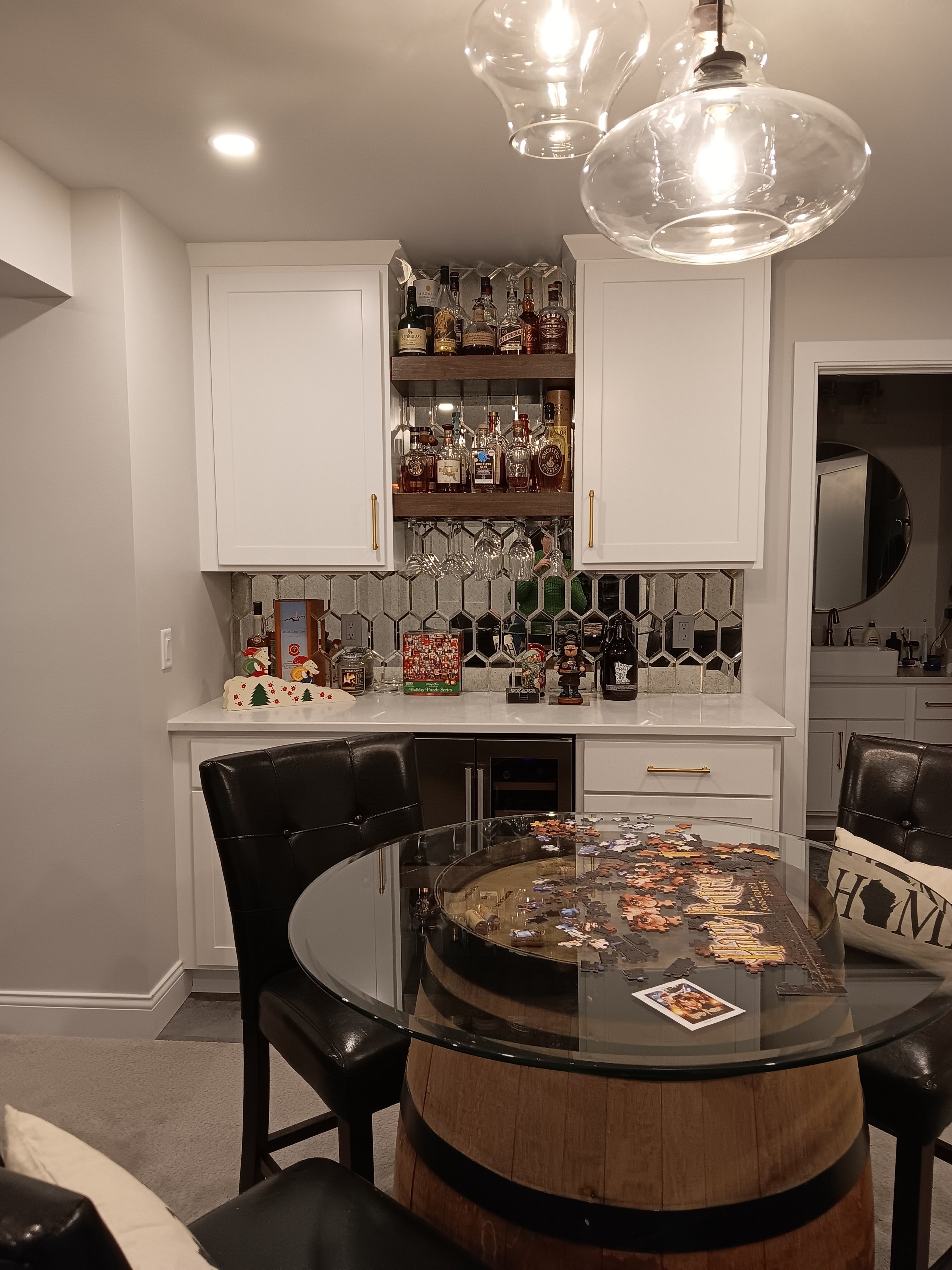 Vintage glass tile really makes this dry bar stand out and perfect for entertaining.