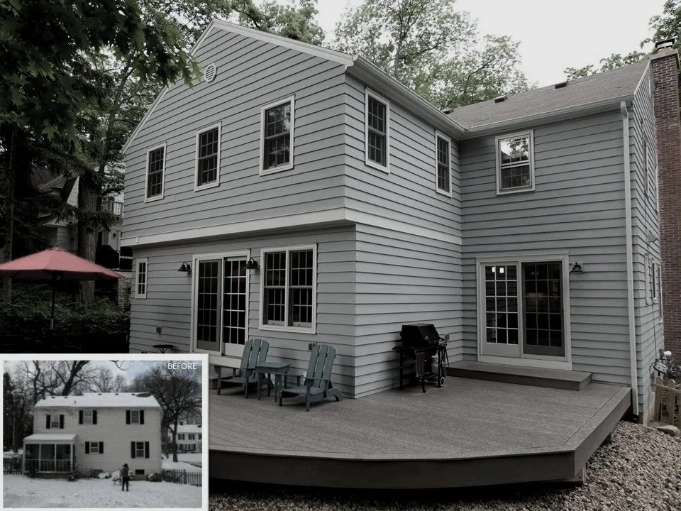 Backyard deck with outdoor furniture and grill, attached to a gray two-story house with multiple windows and sliding glass doors.