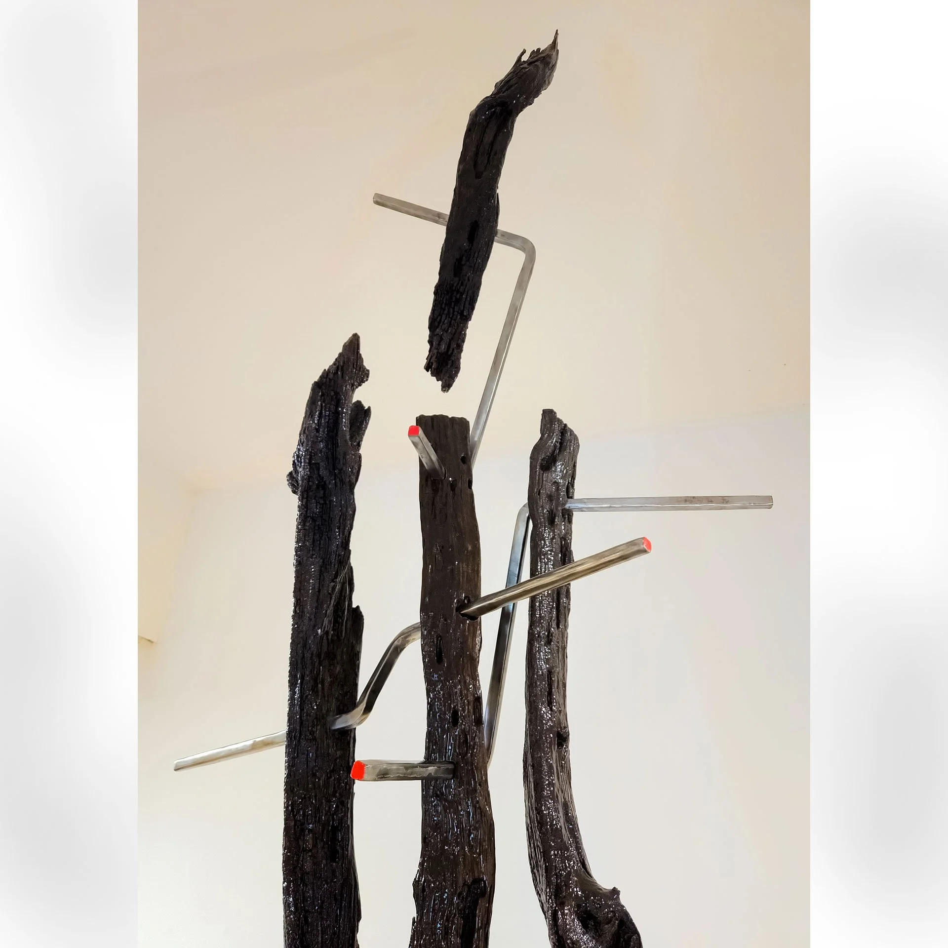 Untitled, 2025. Reclaimed bois d'arc fence posts, steel, epoxy resin, enamel paint – 162 (13.5ft) x 36 x 26 in.