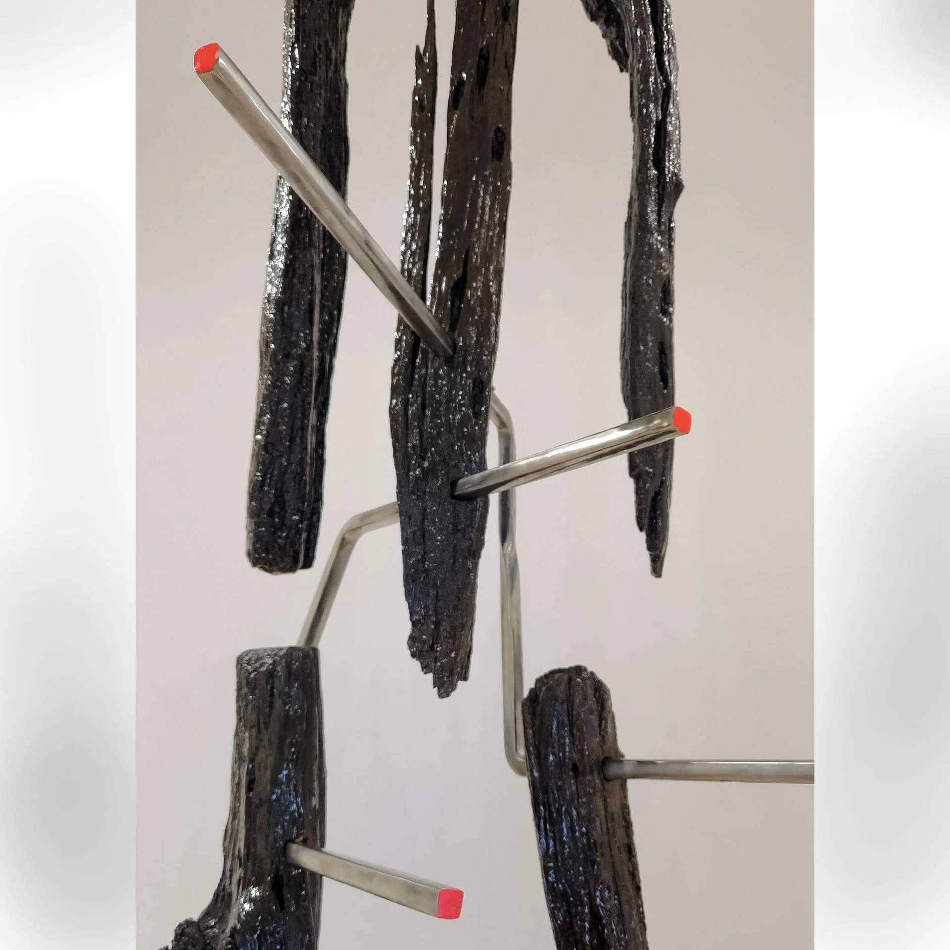 Untitled, 2025. Reclaimed bois d'arc fence posts, steel, epoxy resin, enamel paint – 162 (13.5ft) x 36 x 26 in.