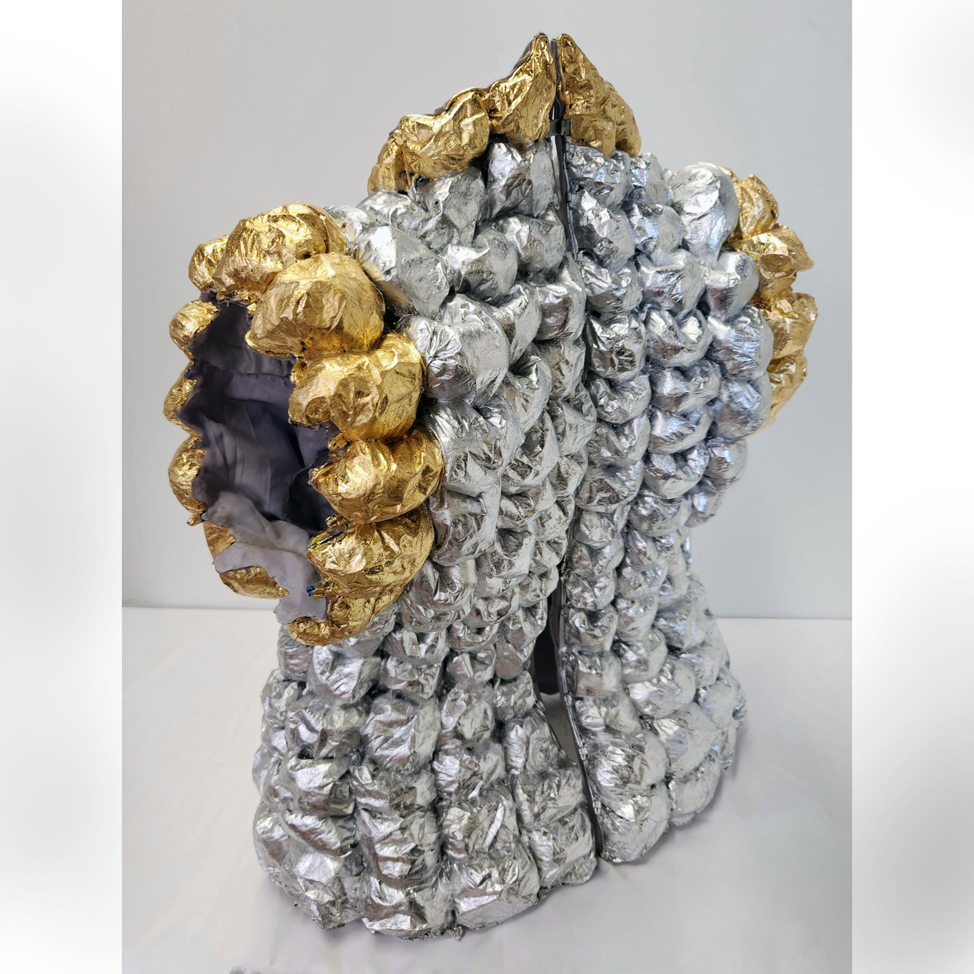 Wants and Needs, 2025. Paper, decoupage, metal foil, dress form, found materials – 25 x 20 x 15 in.