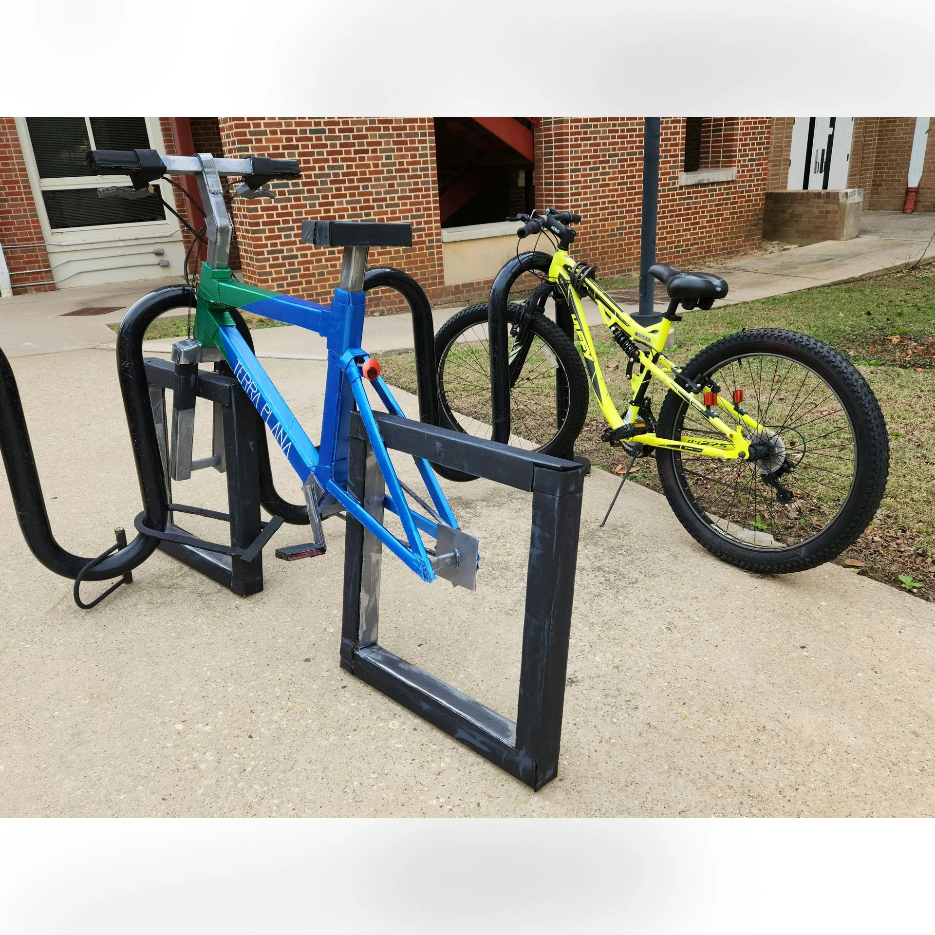 Terra Plana, 2025. Cardboard, hot glue, acrylic craft paint, googly eyes – 38 x 24 x 70 in.