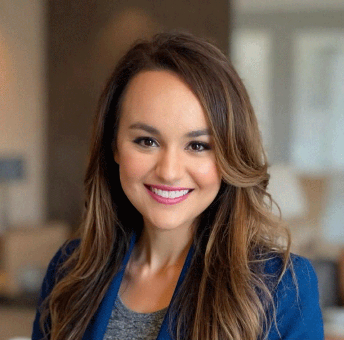 Warm pediatric dentist Dr. Monica McKary specializing in gentle, family-centered dental care for kids, smiling in a friendly headshot