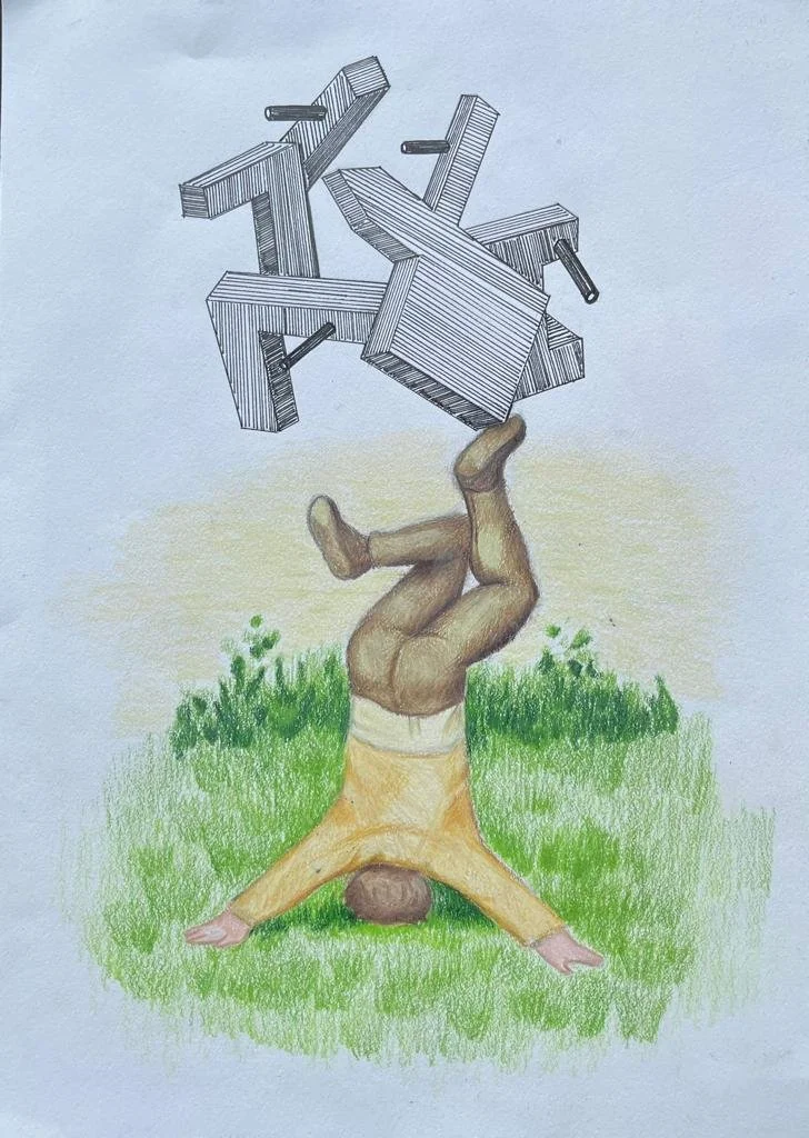 A person in a yellow shirt and brown shorts doing a headstand on grass, with wooden furniture and tools floating above them.