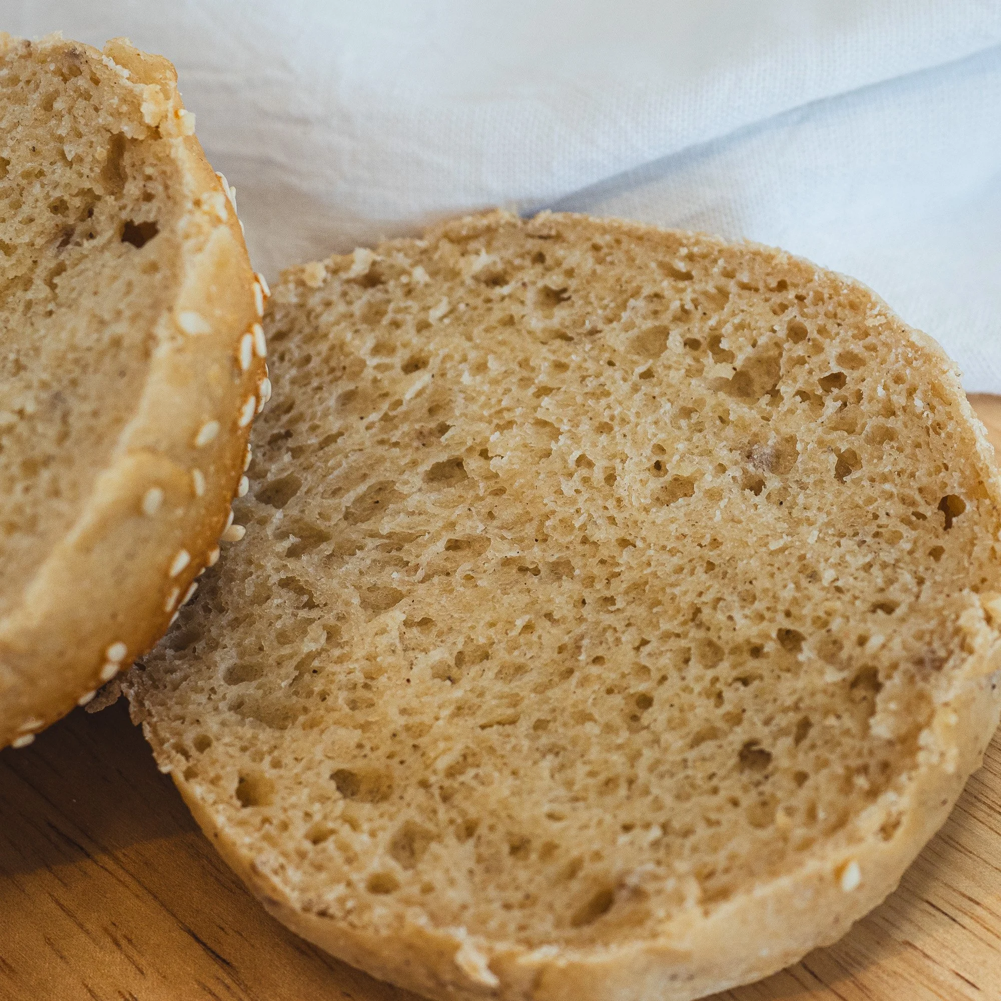 Open sandwich roll showcasing soft, springy crumb