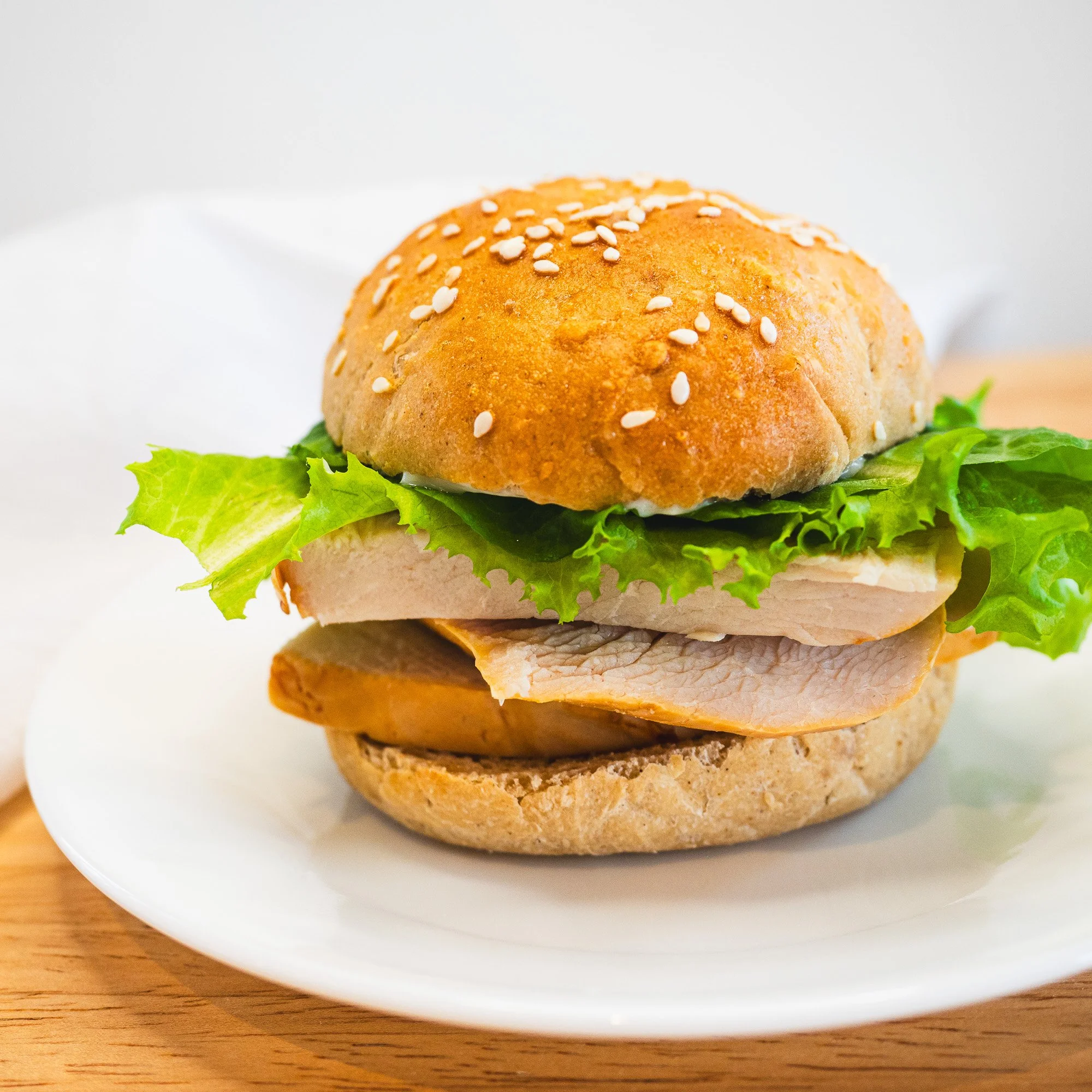 Turkey sandwich on sandwich rolls piled high