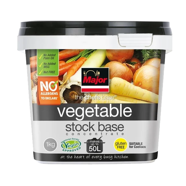 A tub of Major vegetable stock base with a label showing various vegetables like carrots, onions, and leeks, indicating it is vegan, gluten-free, and suitable for coeliacs.