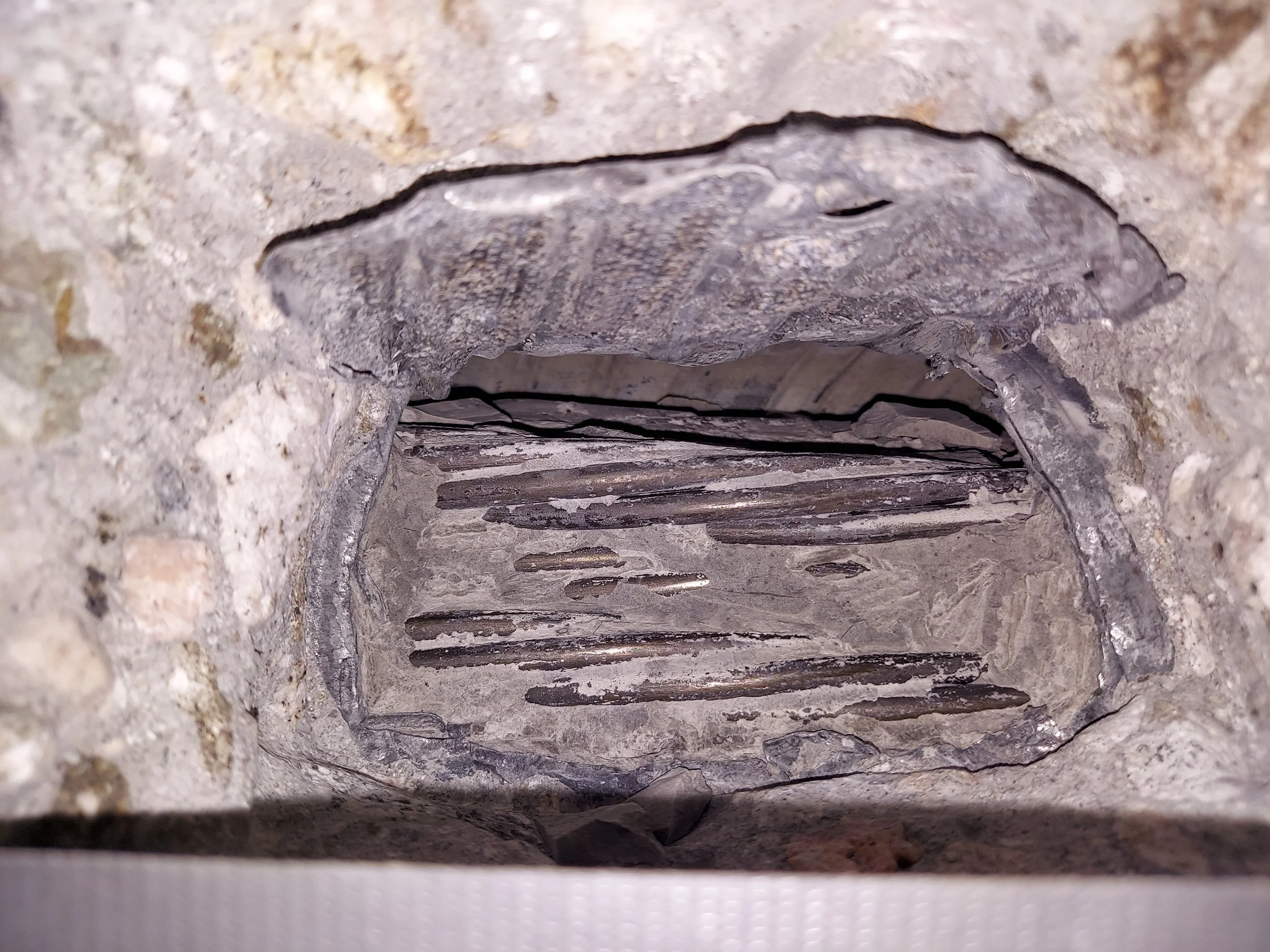 Locating Grout Voids in Post-Tensioning Ducts of a Three-Span Concrete Bridge Using NDT