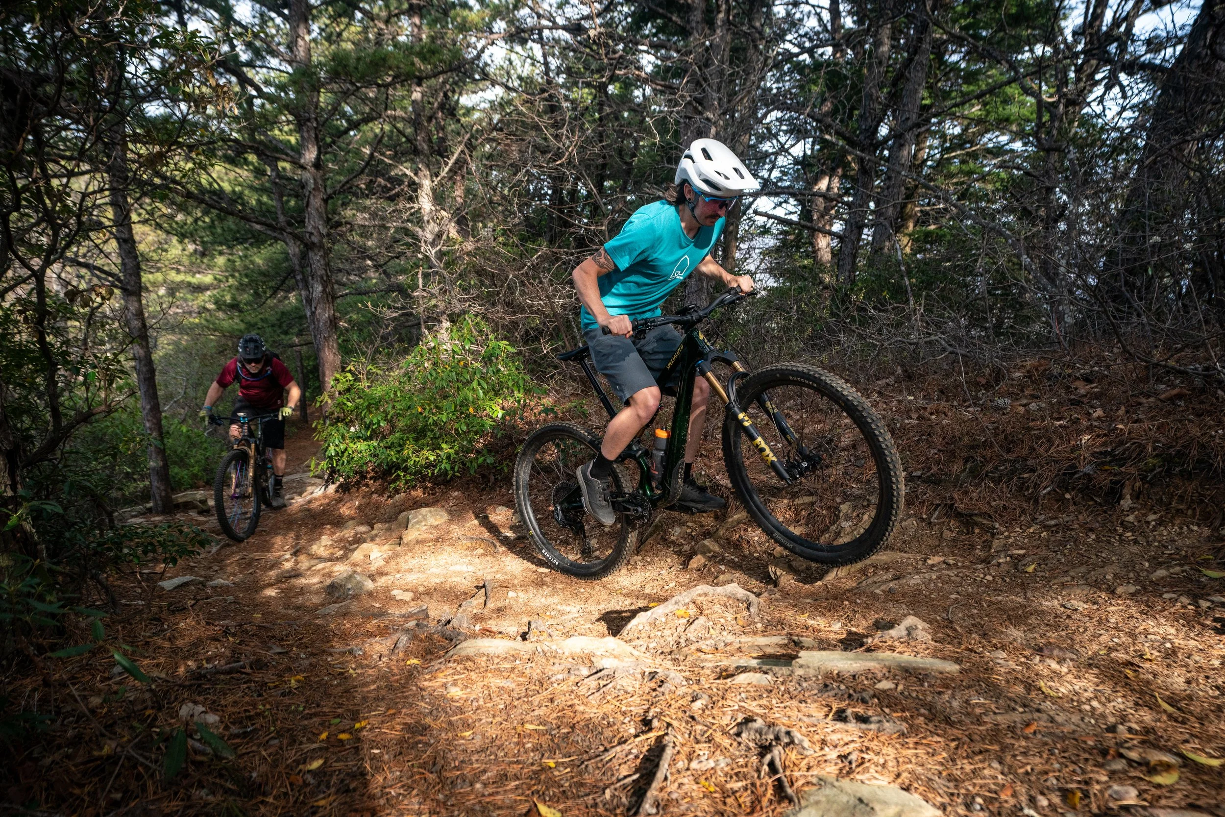 Mountain biker training on technical climb in Brevard, NC