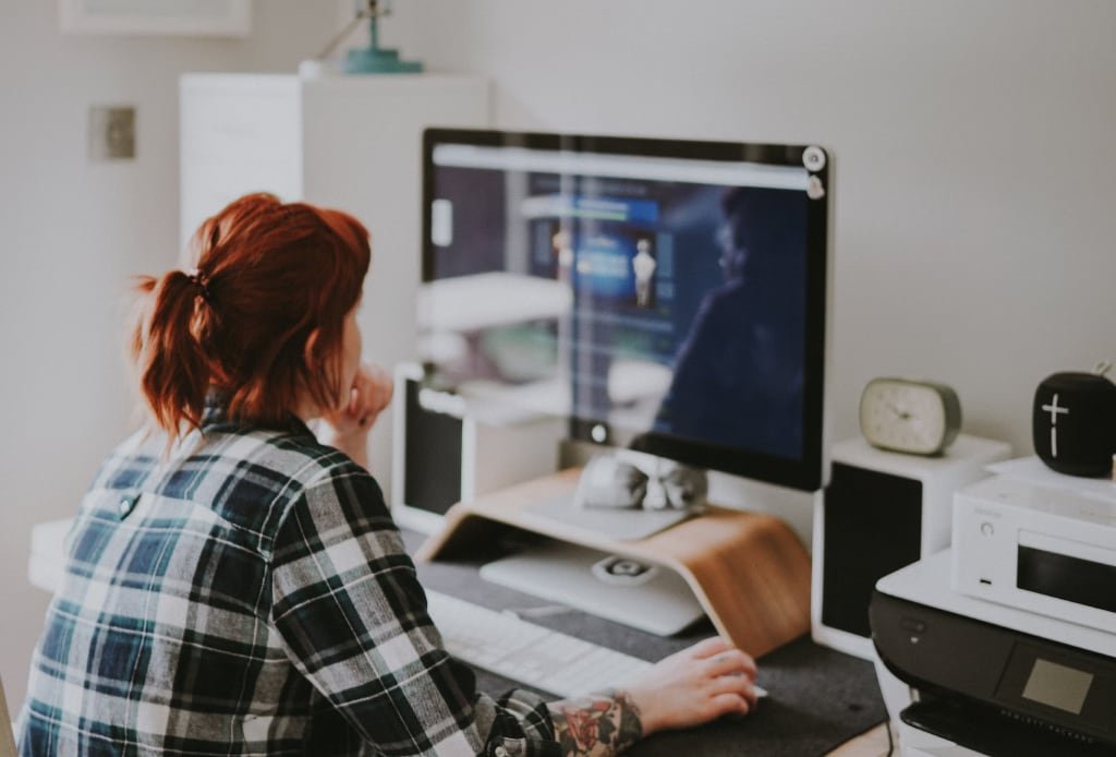 Remote worker looking at screen in home