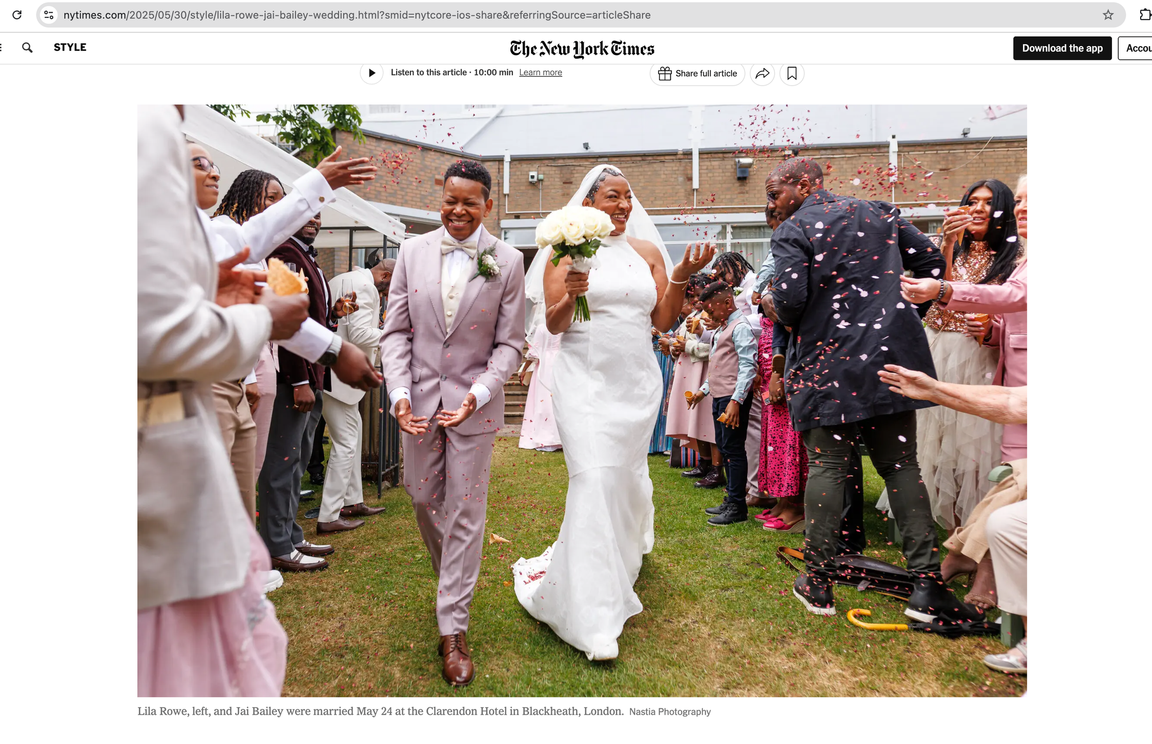 Screenshot of an article in the New York Times with hero shot of black lesbian couple walking down as confetti is thrown by guests.