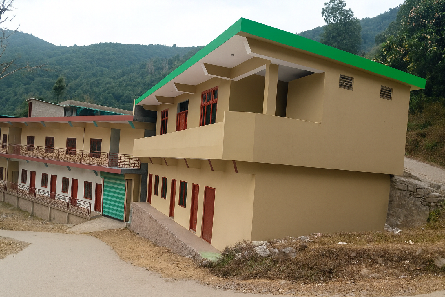 A multi-story building on a hillside with a beige facade, green roof, red window frames, and a roll-up garage door, surrounded by a dirt road and green hills in the background.