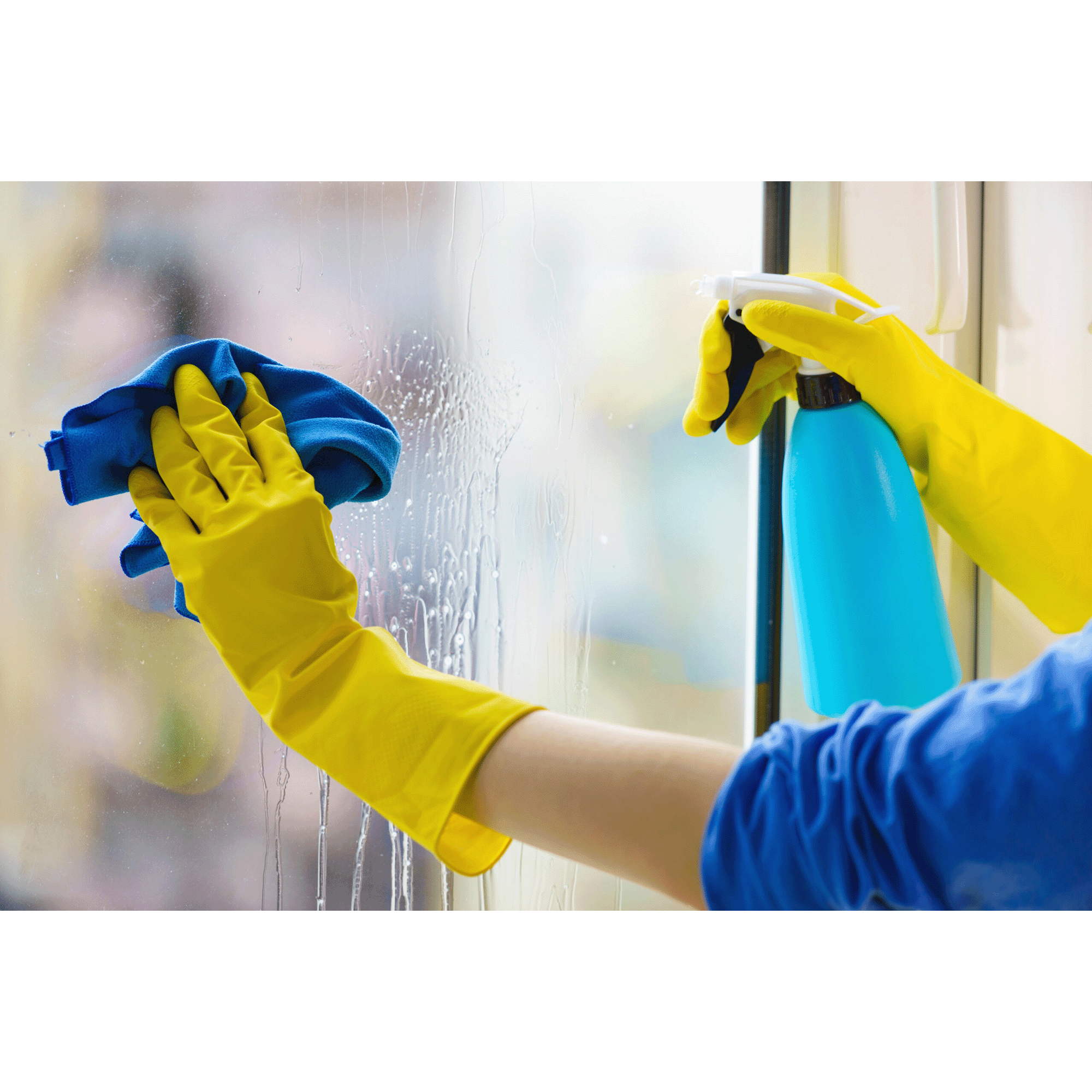 Person wearing yellow gloves cleaning a window with a spray bottle and cloth.