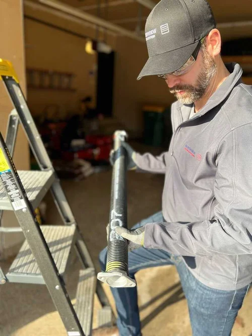 Northview Doors technician servicing a garage door