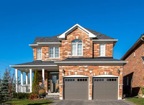 Residential home with garage doors — Twin Cities metro