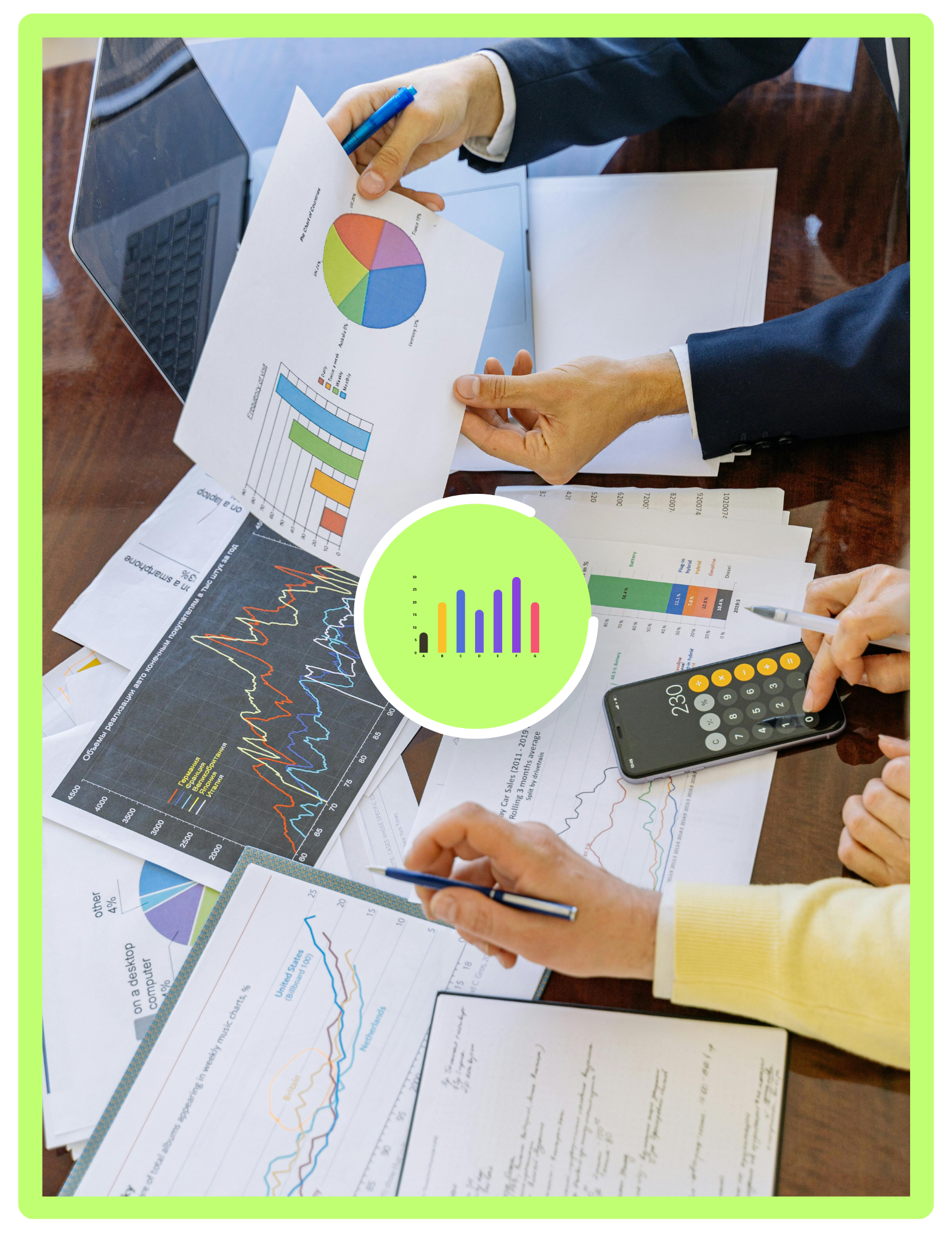 Business meeting with multiple people reviewing charts, graphs, and data on papers, with a laptop and a calculator on the table.
