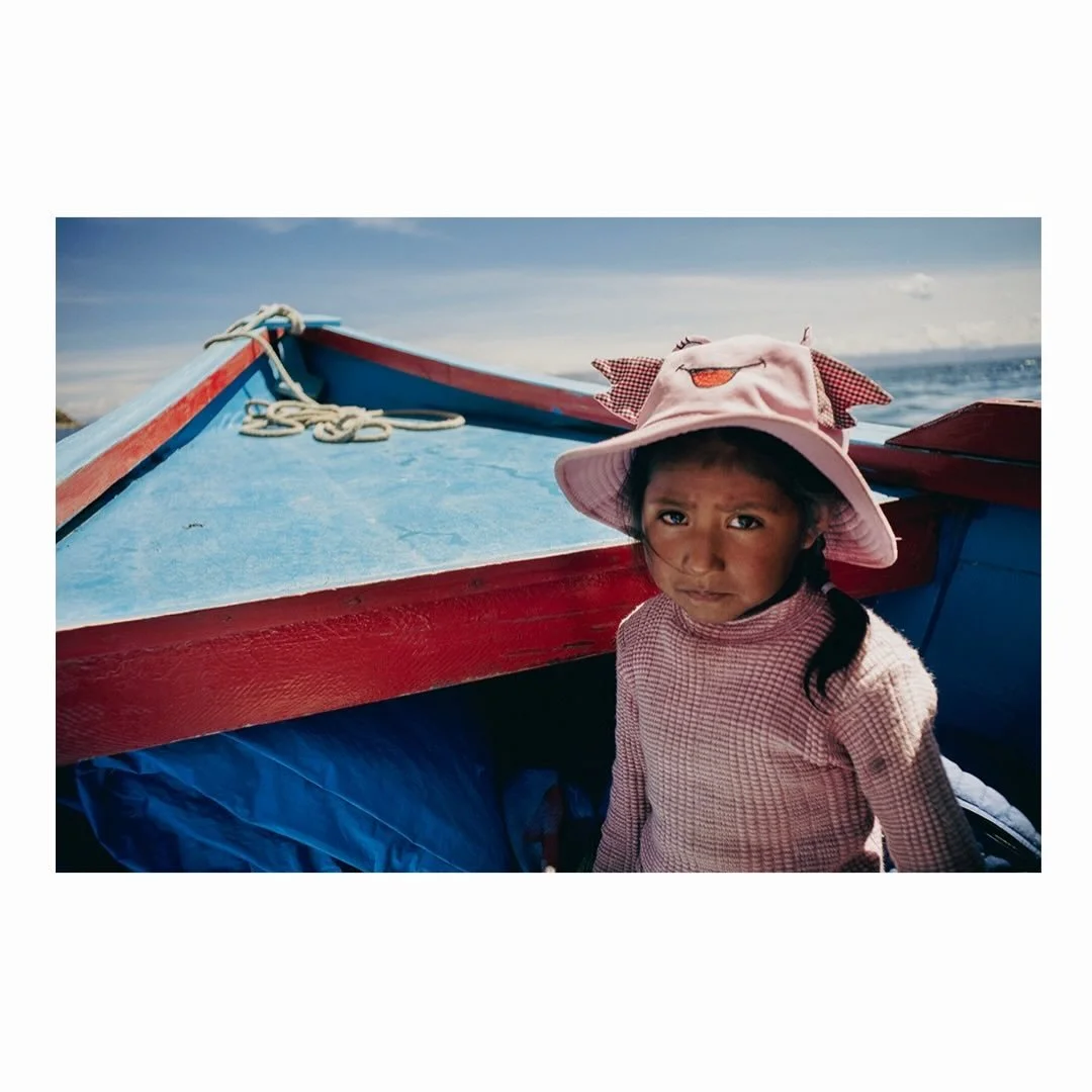 Isla del Sol &mdash; no cars, just boats, donkeys, and dress shoes.
&bull;
A boat ride from the south to the north costs 500 BOB ($70 USD for 6 ppl). I thought the girl on the boat was sad because I took her photo without asking, but it turned out sh