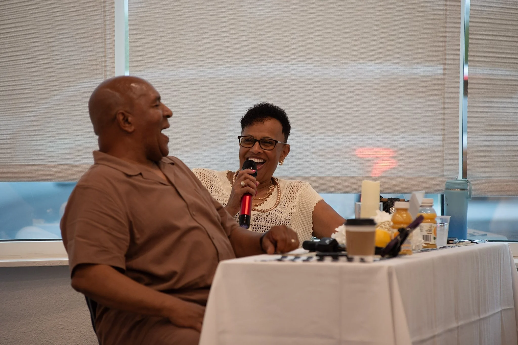 Couples connecting and laughing together during fellowship time at a Lead in Love marriage retreat.