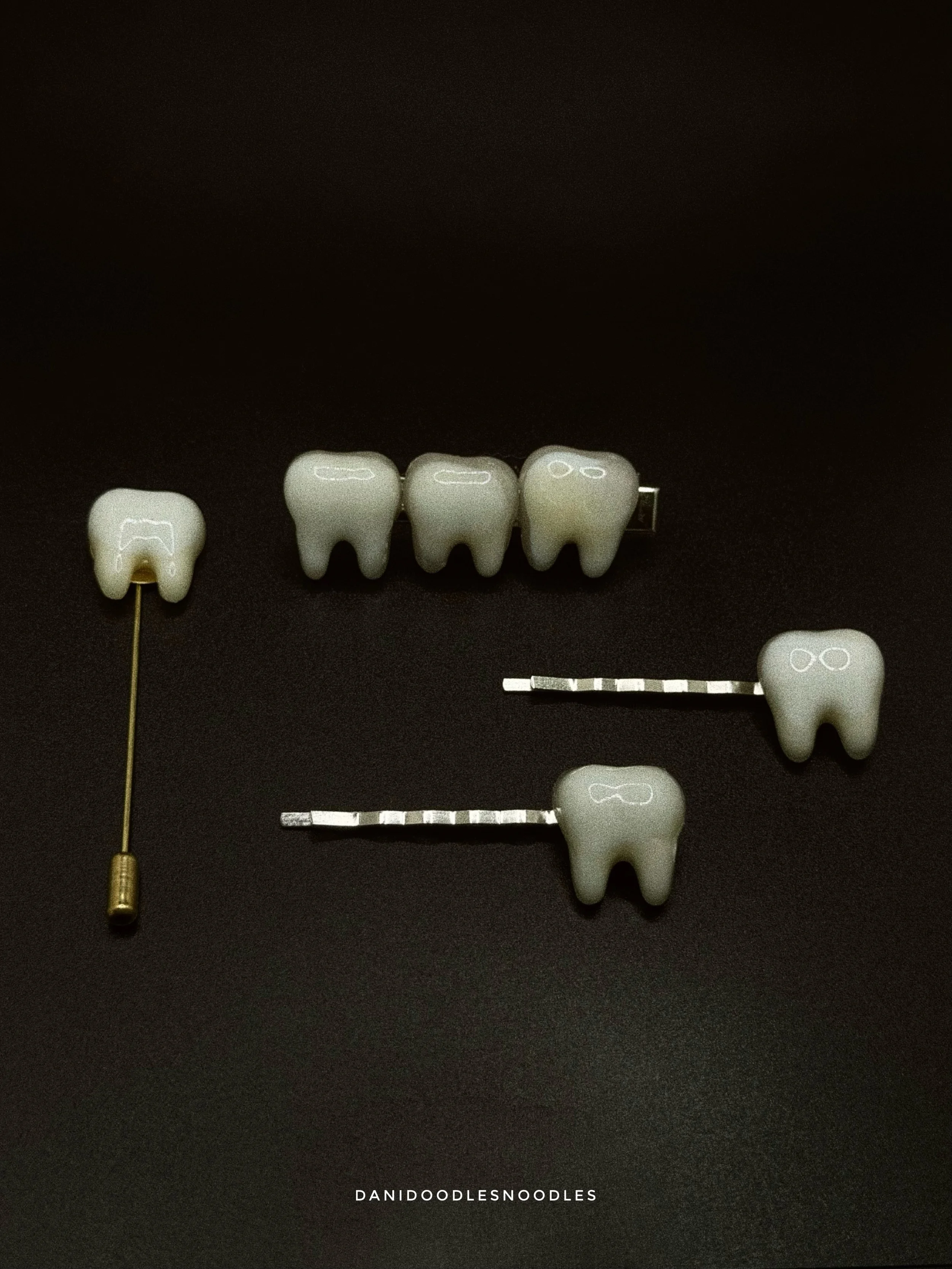Tooth hair pins and vertical lapel pins made out of fused glass. I wanted to wait for Cemtember, but couldn&rsquo;t resist!

Photos by @ohhey.joseph