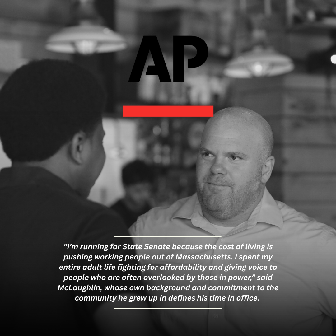 Two men having a conversation inside a restaurant or cafe. One man with light skin and a shaved head looks at the other man with dark skin and an afro. There are hanging pendant lights and a wooden wall in the background. Overlaid text includes the AP logo and a quote about running for State Senate.