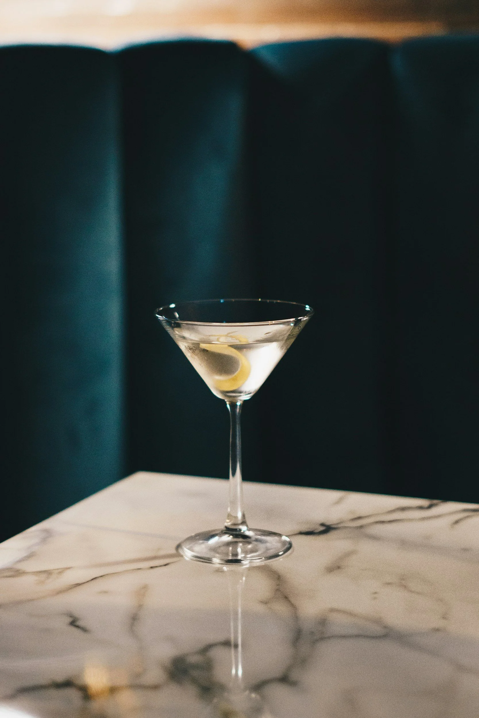 A martini glass with a lemon twist