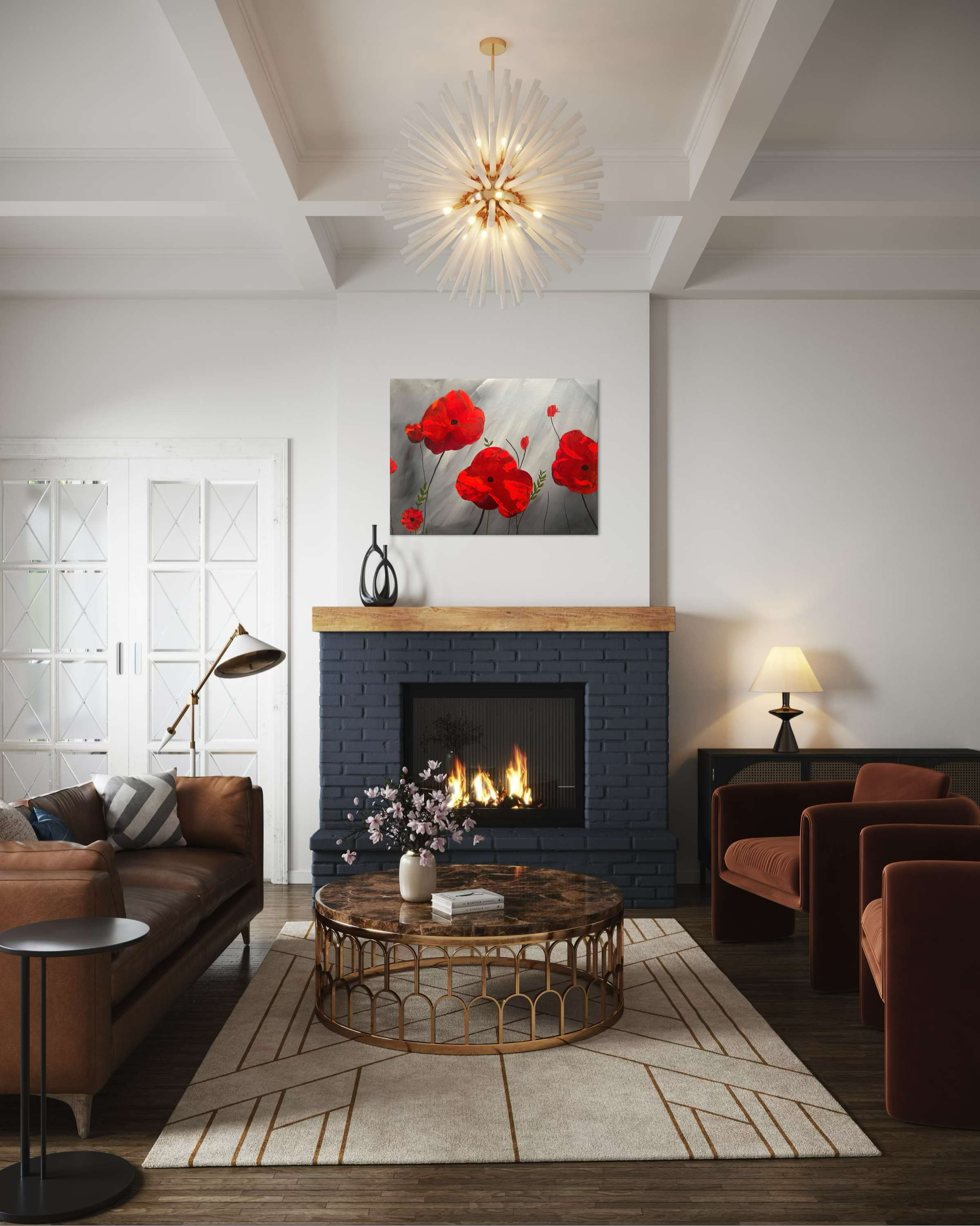 Living room with a fireplace, leather sofa, armchair, coffee table, and a modern chandelier, with artwork of red poppies above the fireplace.
