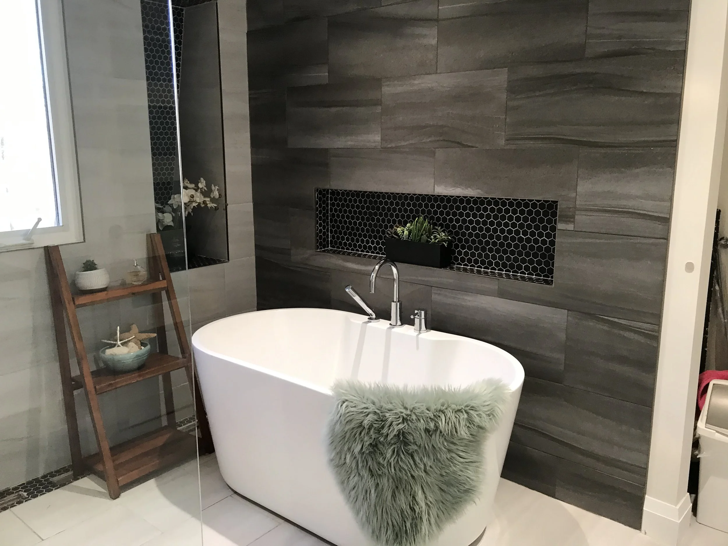 After picture of completed bathroom with bathtub, featuring contemporary design and upgraded features by Burcon Construction.