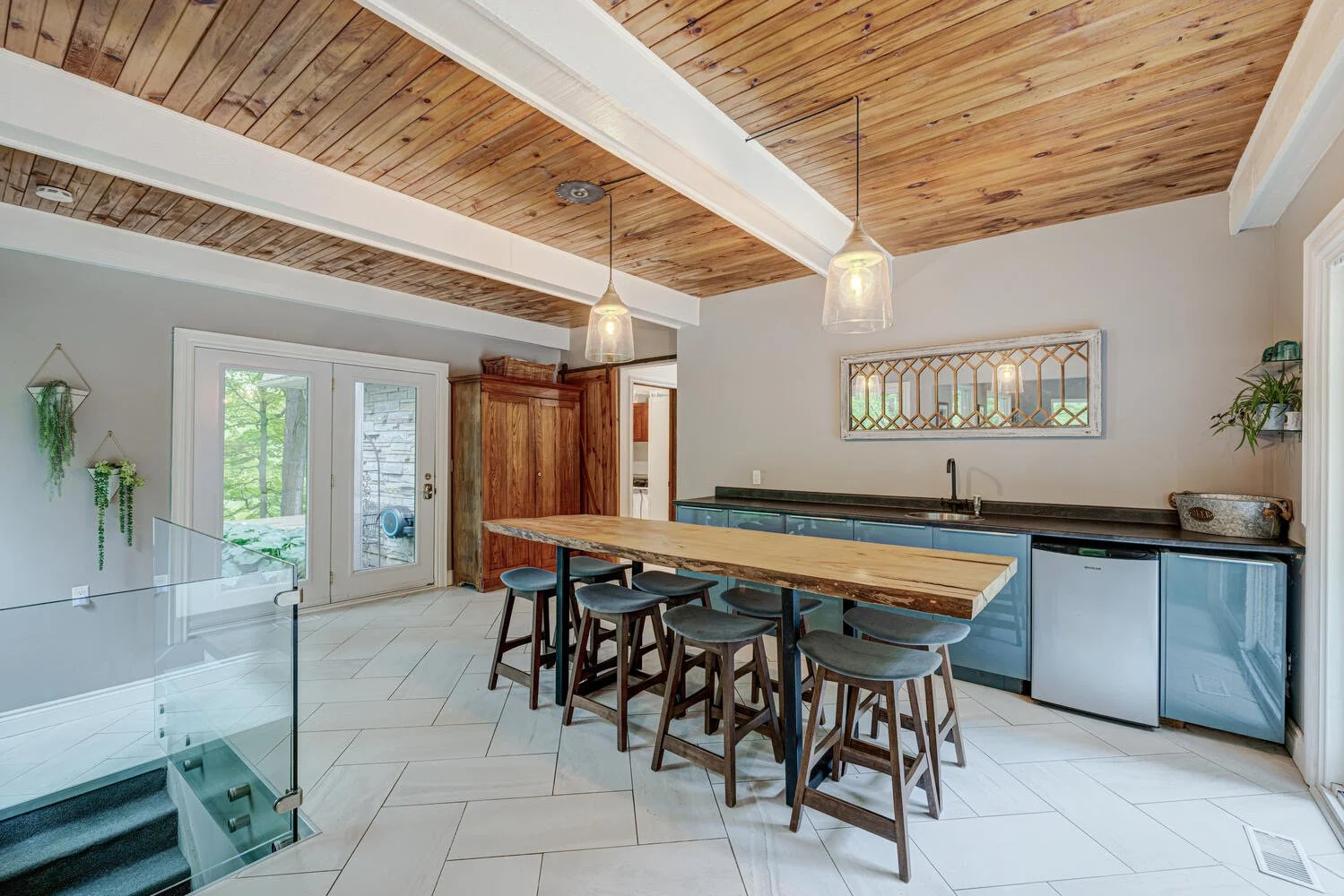 After picture of completed bar area, featuring modern design and functional space by Burcon Construction in Komoka, Ontario.