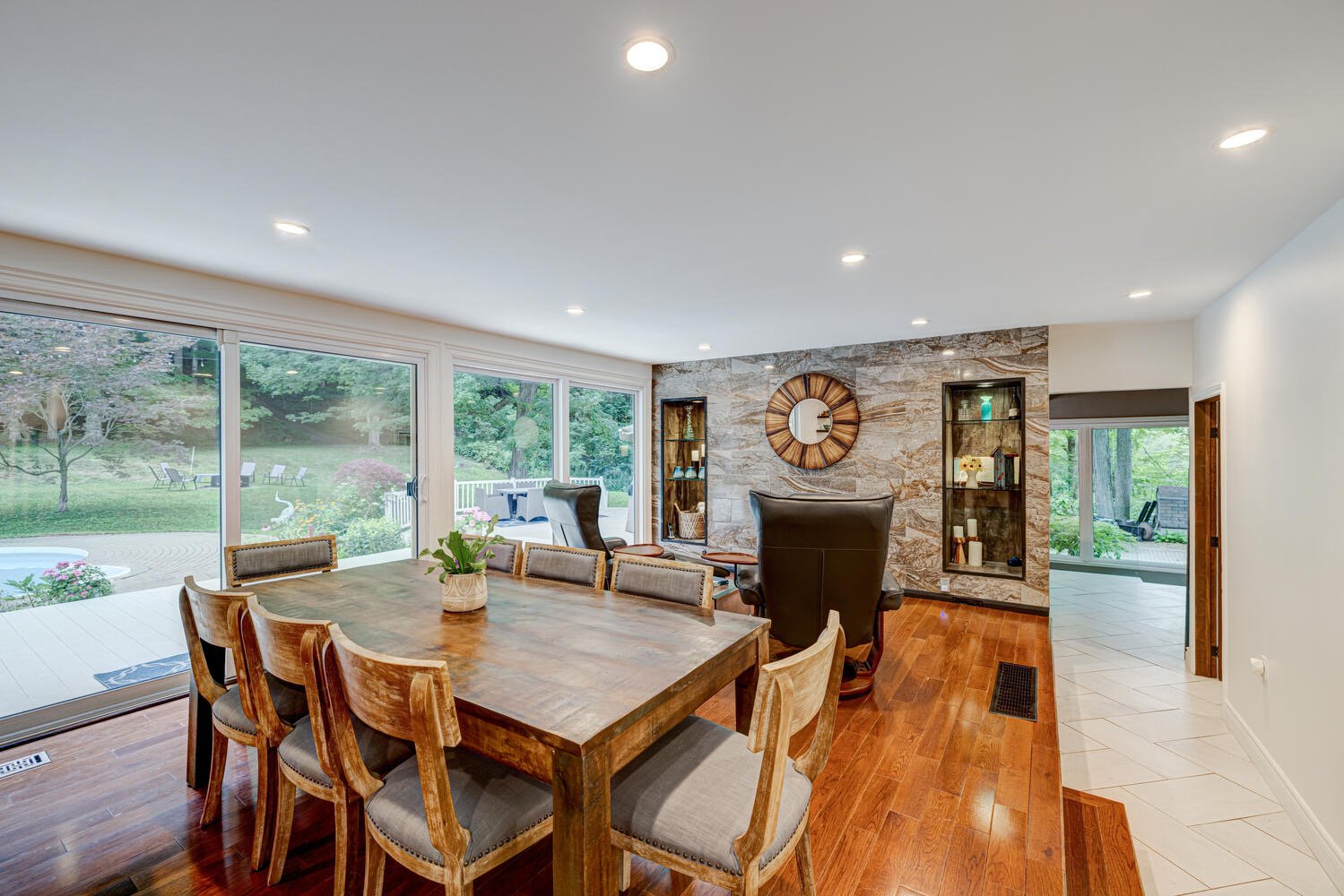 After picture of fully renovated living room, showcasing modern design and increased natural light by Burcon Construction in Komoka, Ontario.