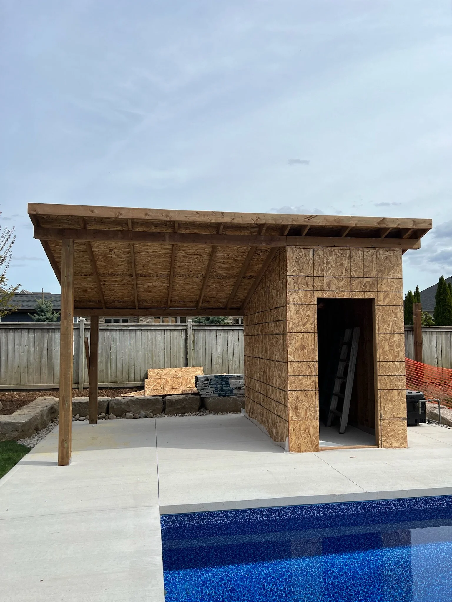 Progression of pool shed construction in Kilworth, with focus on framework and ongoing work by Burcon Construction.