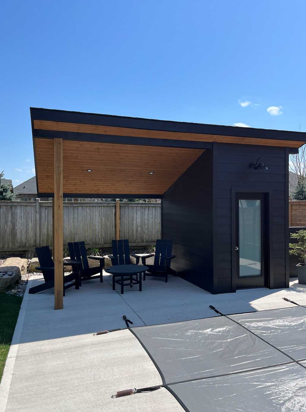 Completed pool shed in Kilworth by Burcon Construction, featuring covered porch area, functional storage, and modern design.