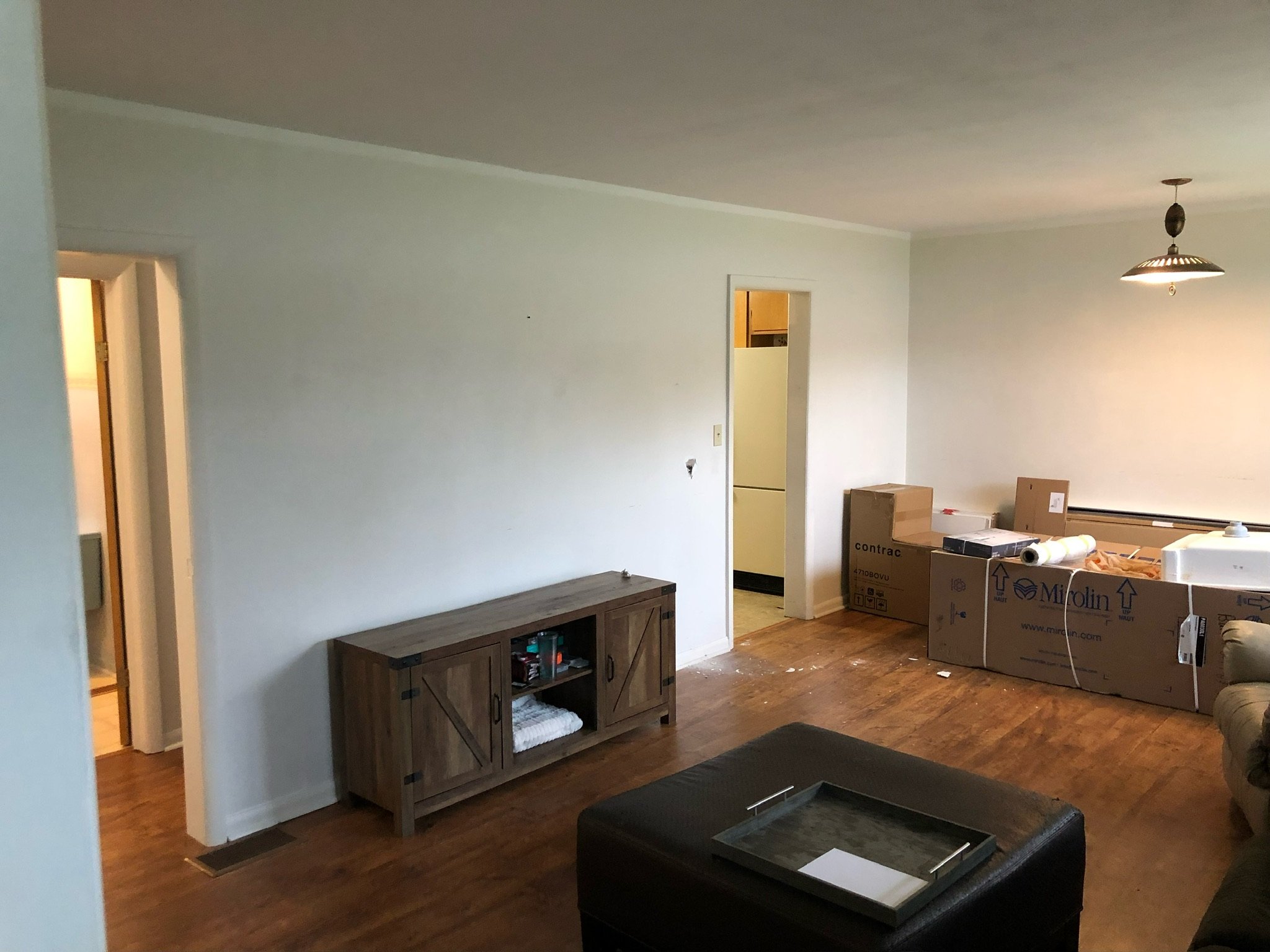 Before picture of outdated living room in Komoka prior to renovation by Burcon Construction, highlighting the need for transformation.