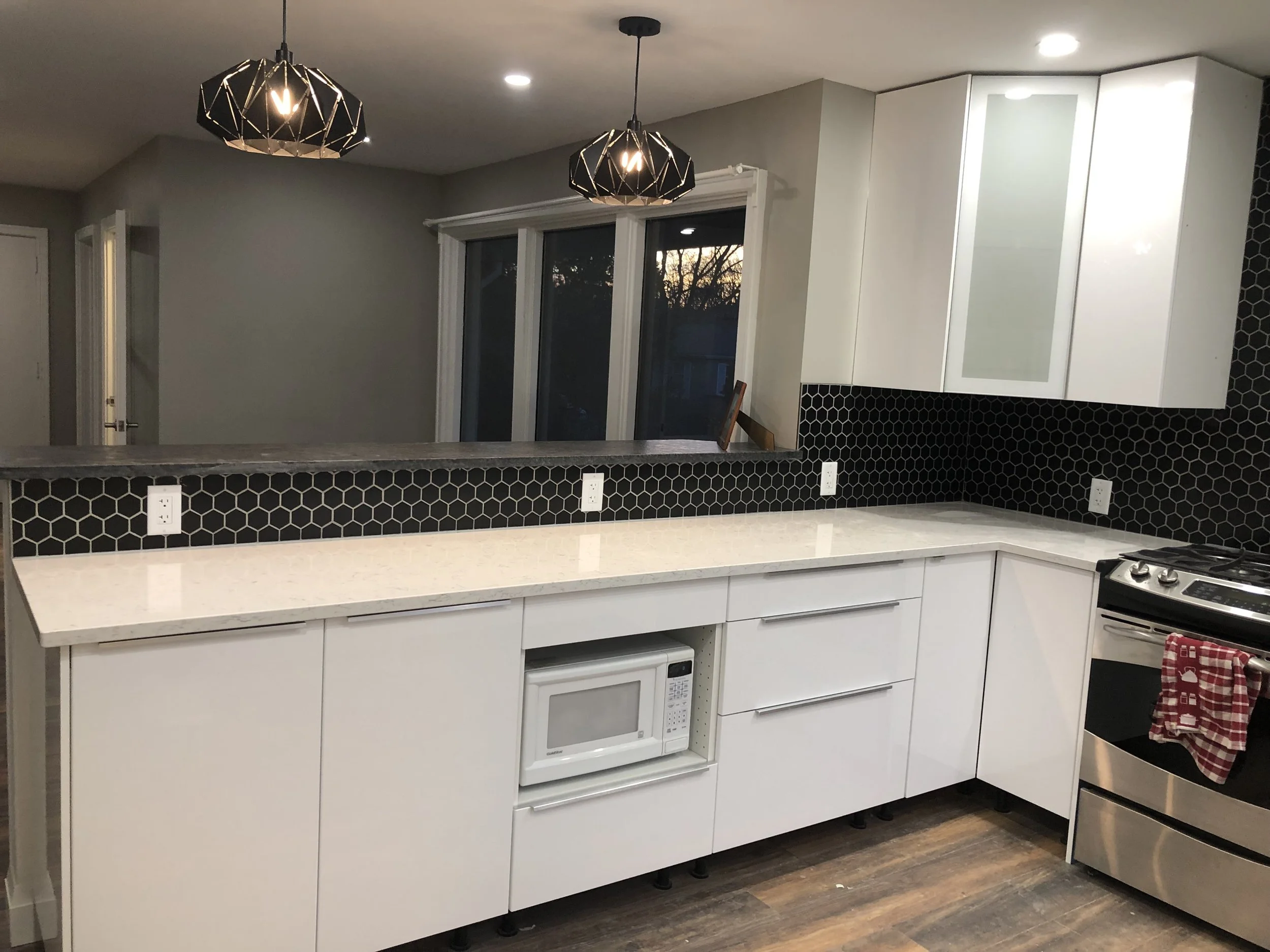 Another view of the completed kitchen renovation in London by Burcon Construction, showcasing island and countertops.