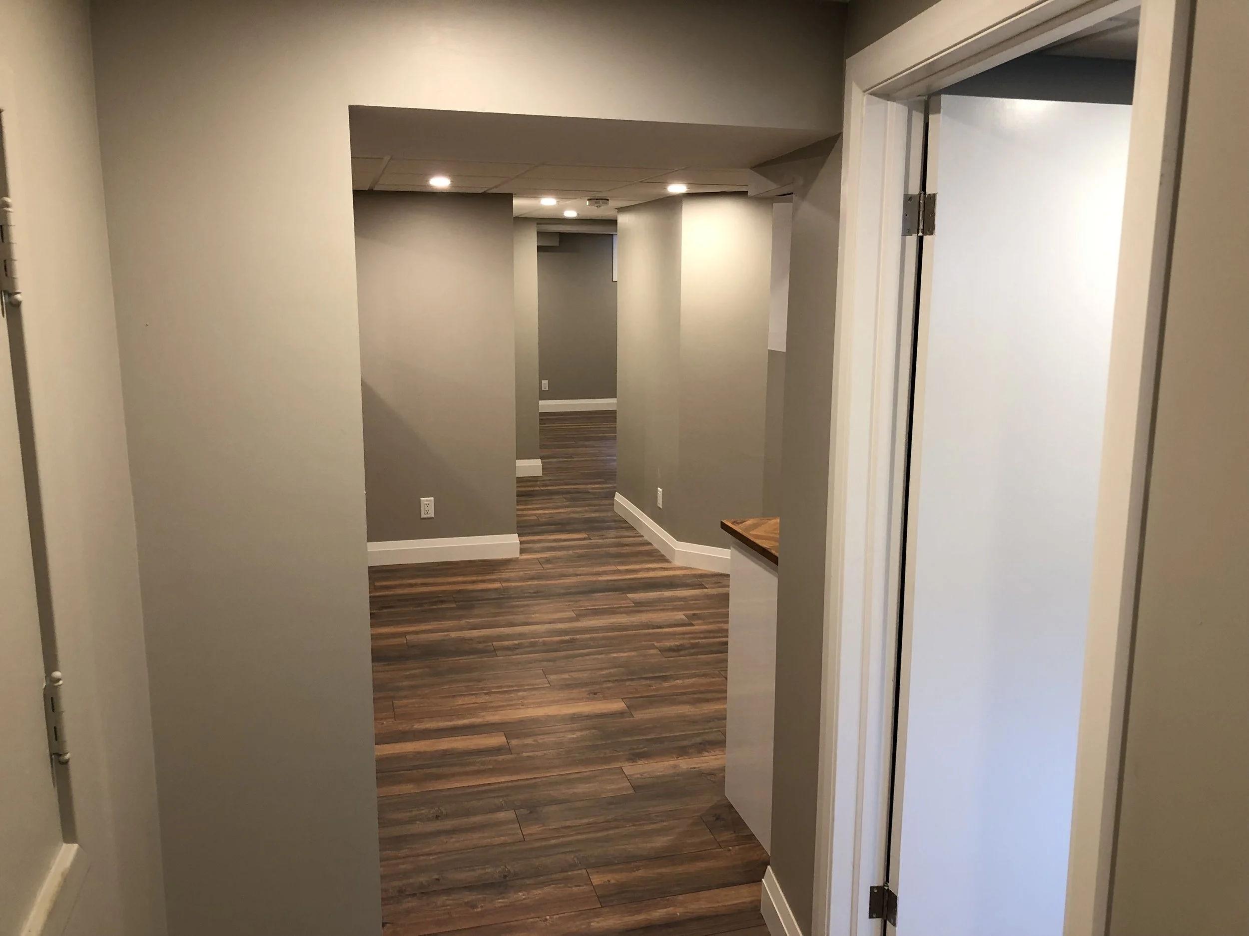 Completed basement renovation in London by Burcon Construction, featuring enhanced space and amenities for modern living.